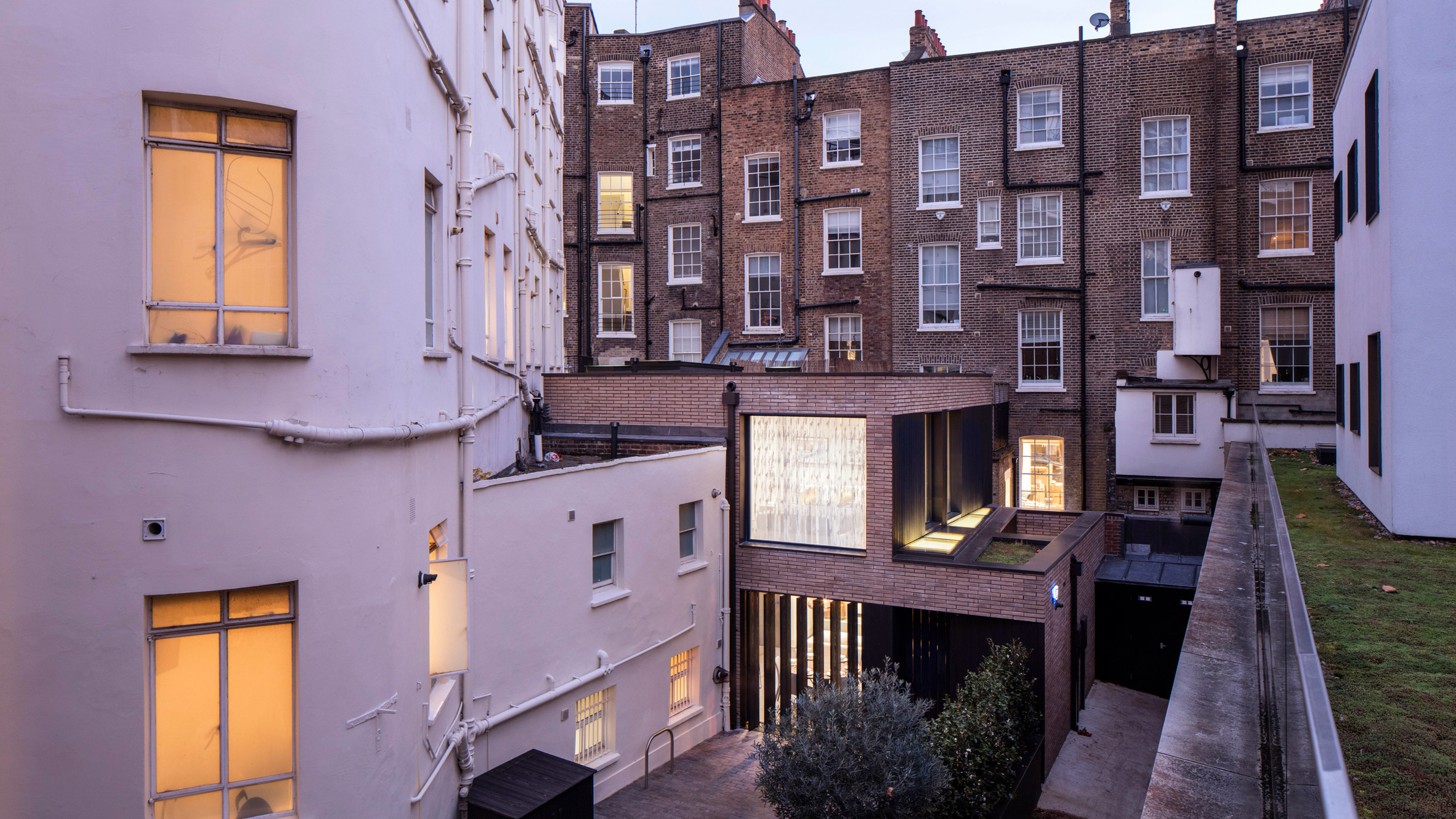 Pivoting louvres conceal windows of mews house by Belsize Architects-0