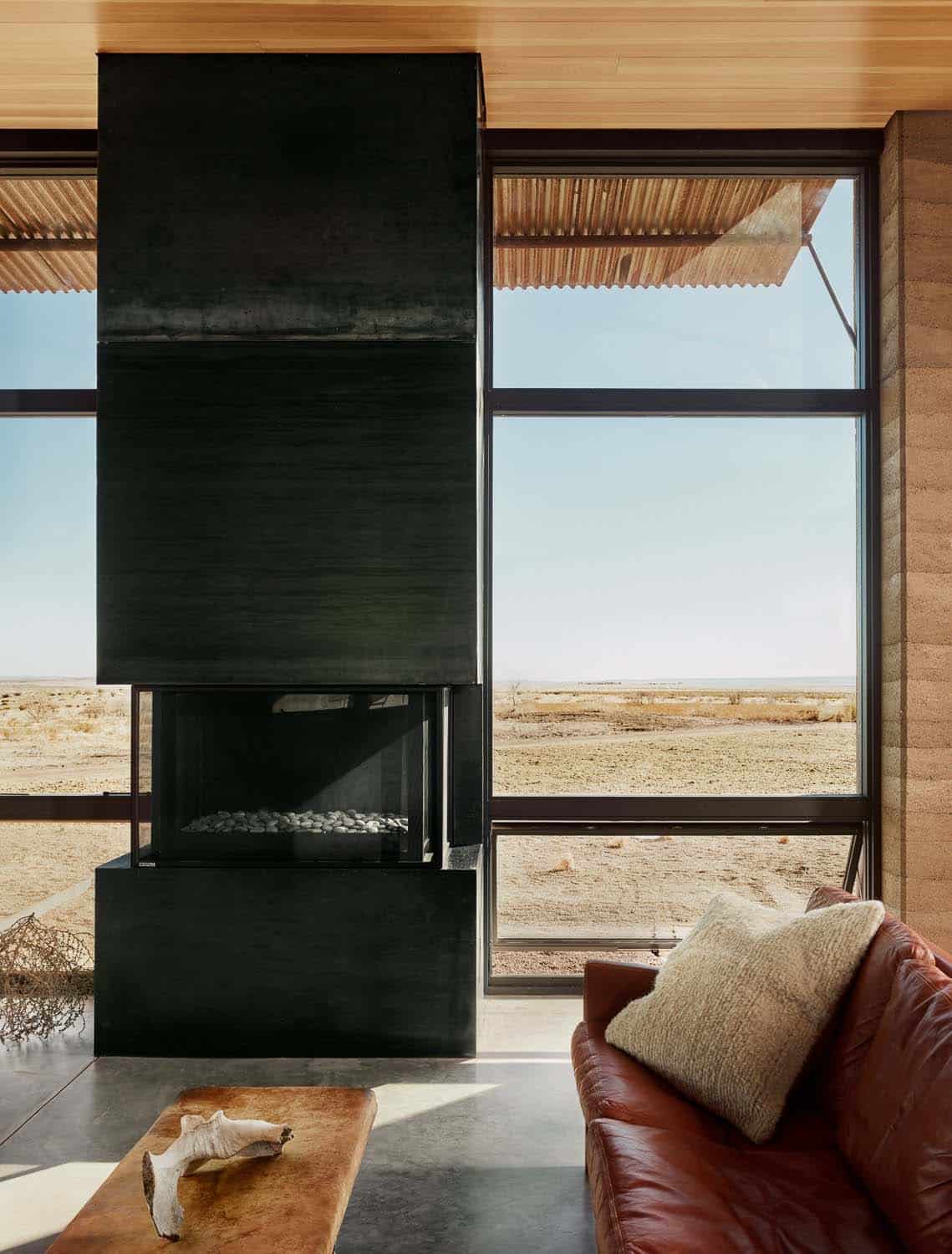 See this remarkable rammed earth house nestled on a Texas ranch-13