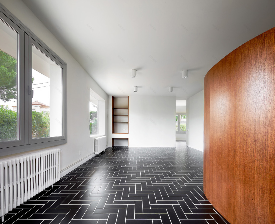 Revamped Barcelona house features herringbone floors and a covert dining area-2