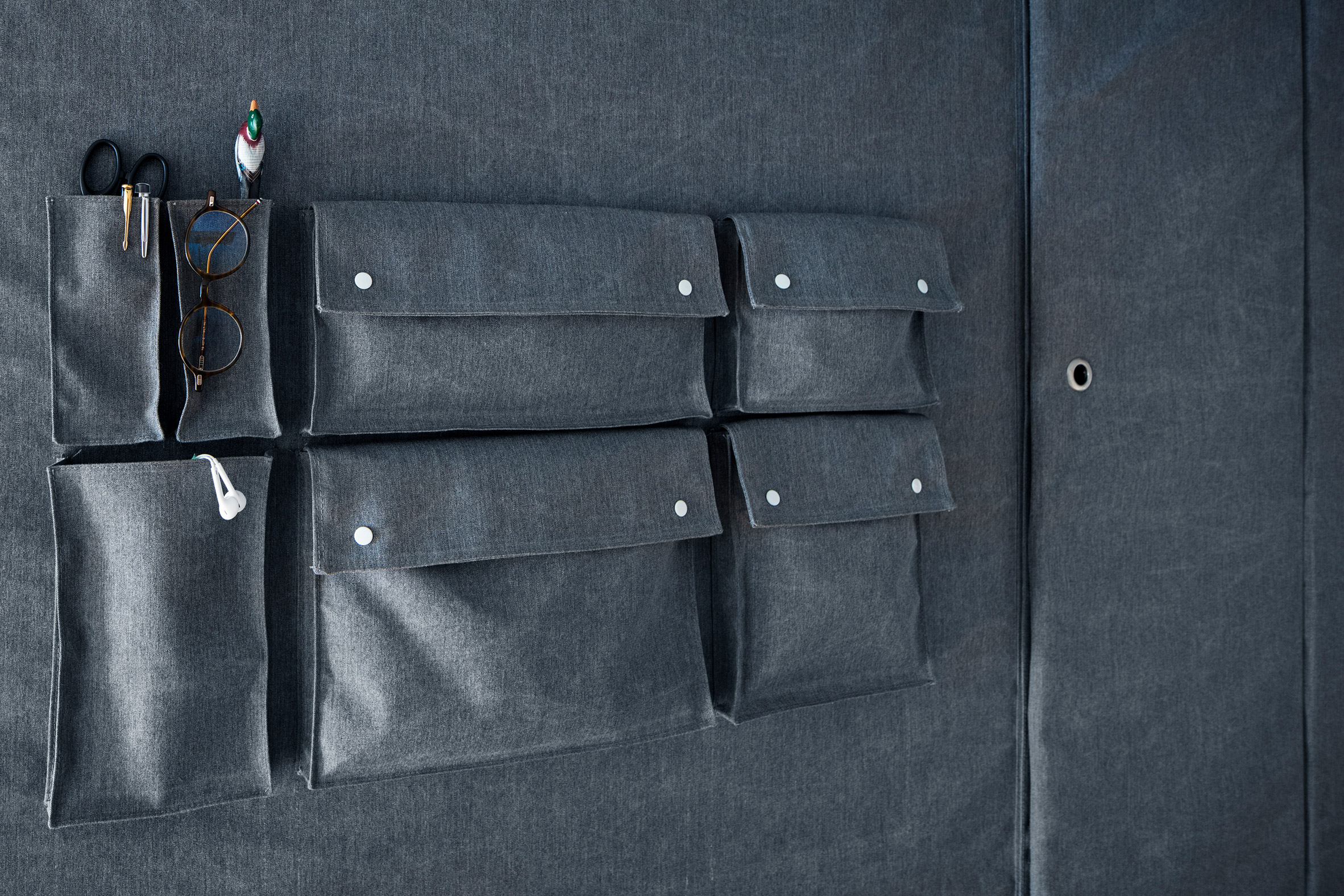 Renovated apartment in Tokyo has storage pockets sewn into its walls-14