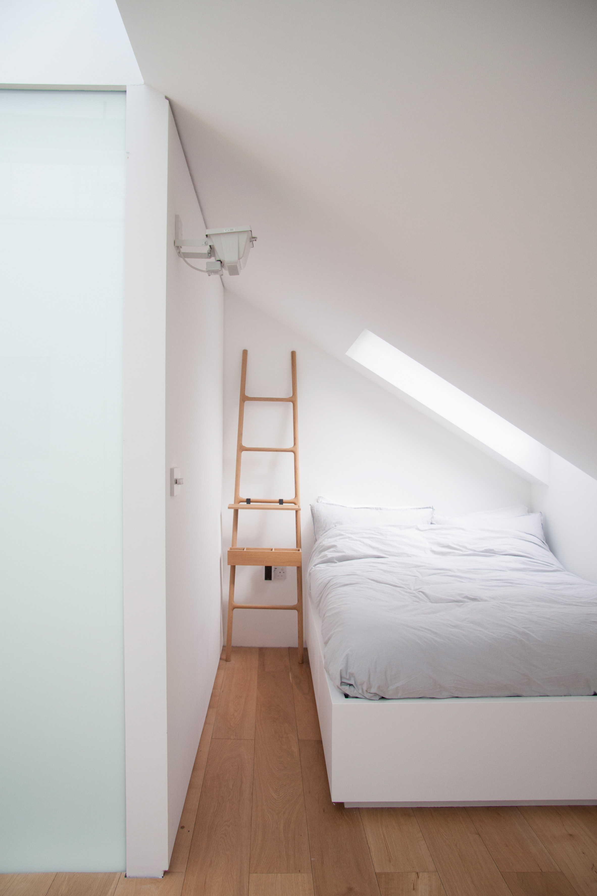 Shelving units and concealed doors compartmentalise London home-21