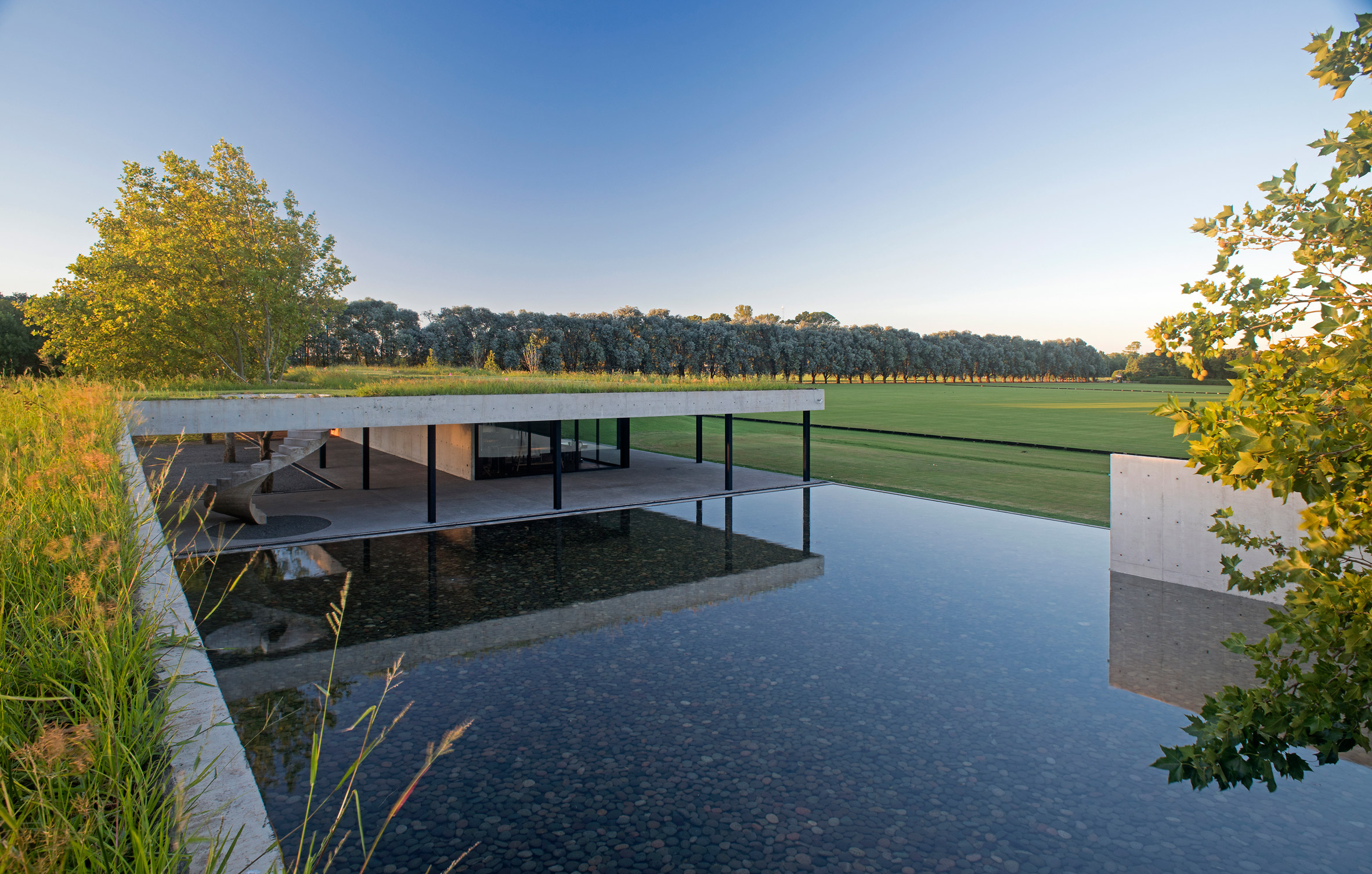 Polo stables features grassy roof for horses to graze and spectators to sit-13