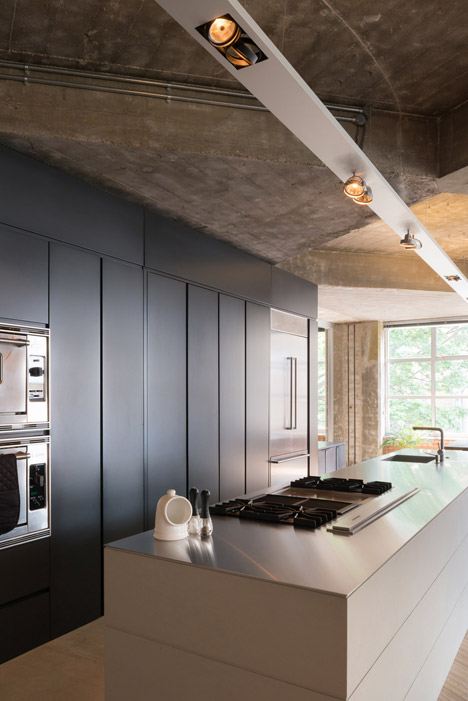 Apartment by Inside Out Architecture features chunky concrete beams-6