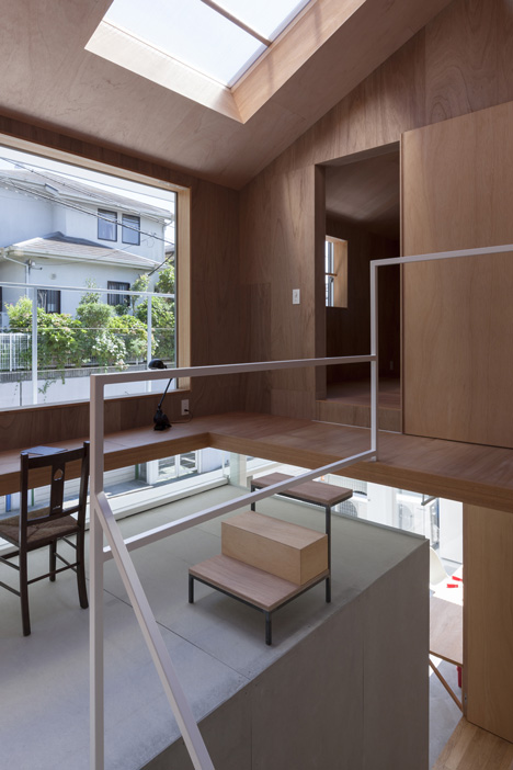 House in Kawanishi by Tato Architects with hipped roof and stilts-16