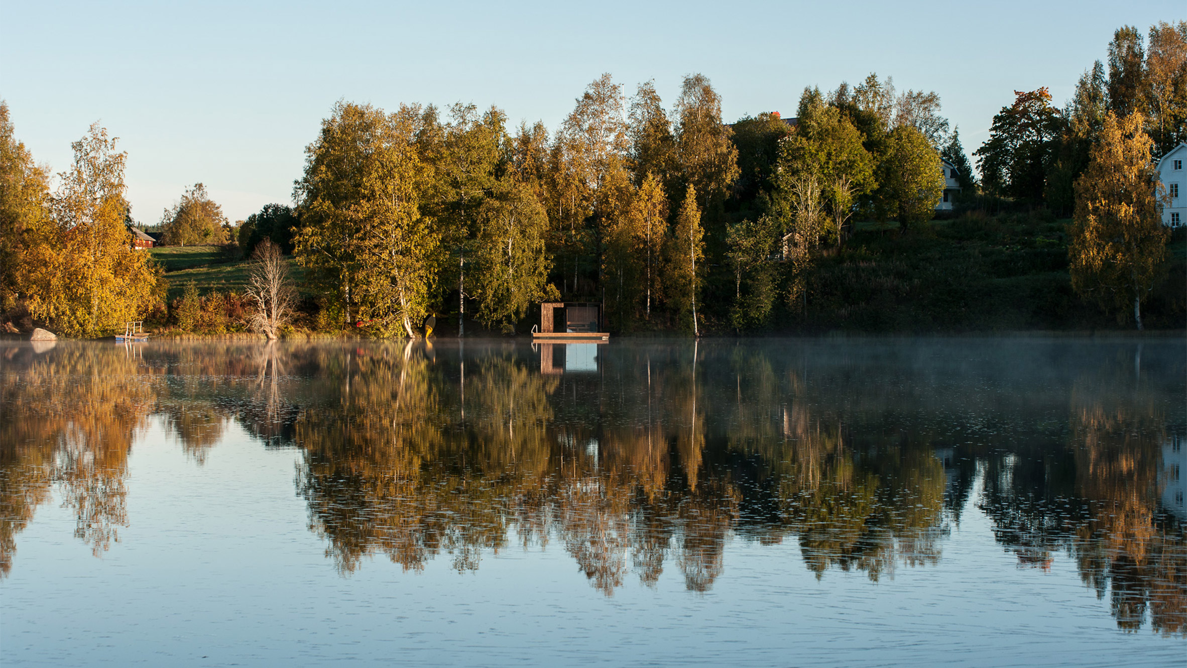 Small Architecture Workshop's charred-wood sauna floats on Swedish lake-5