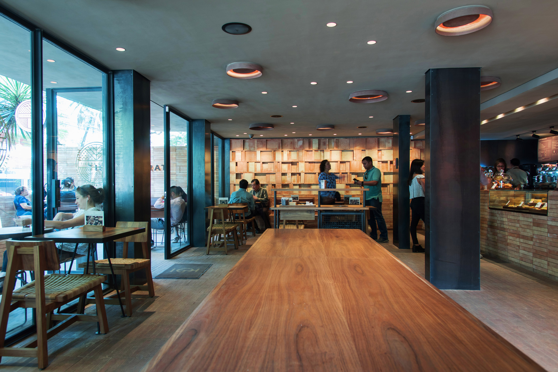Faceted wooden panels form Mexico City cafe by Esrawe and Cadena-6