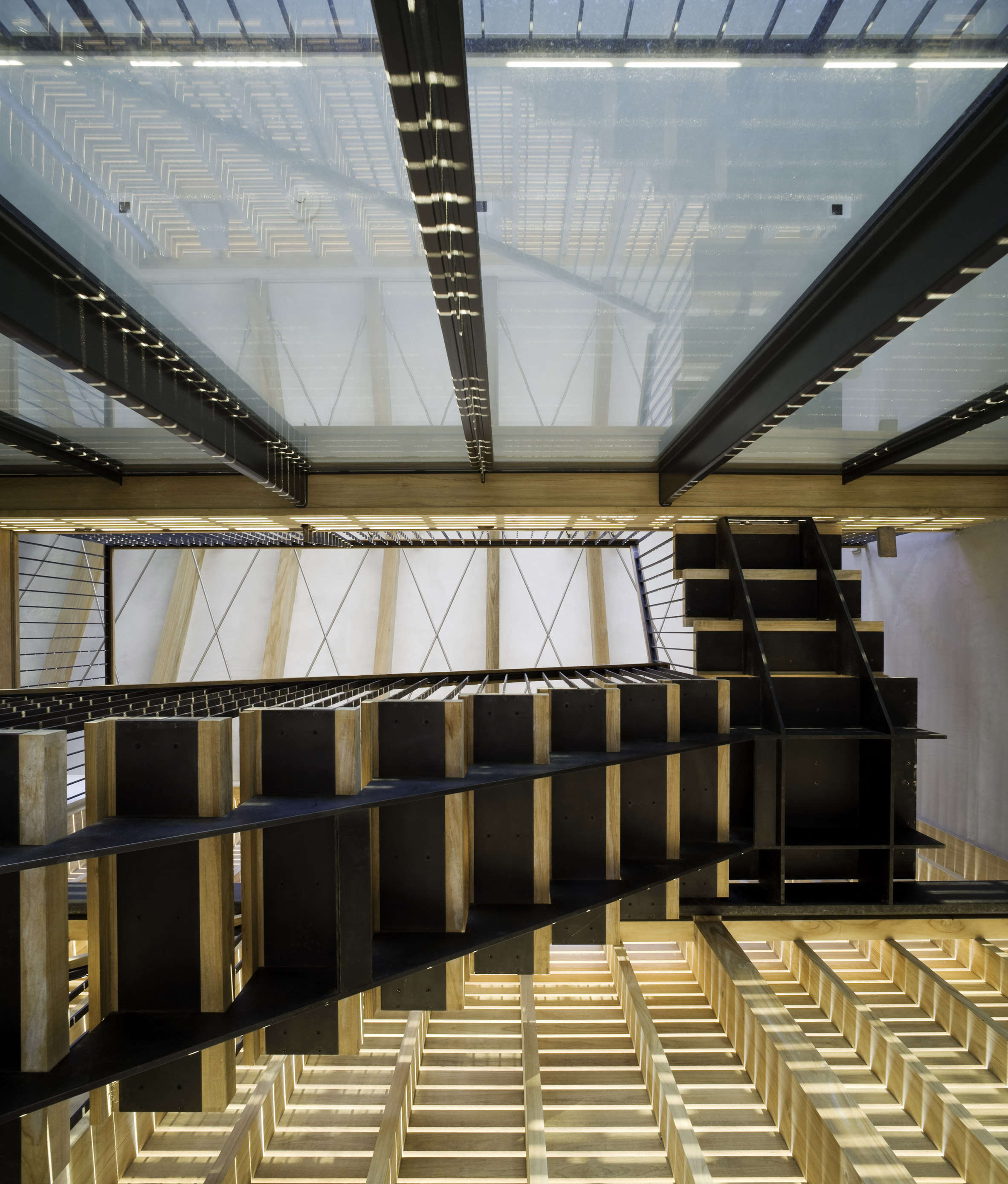 Lights glow through facades of Hamptons home by Leroy Street Studio-10