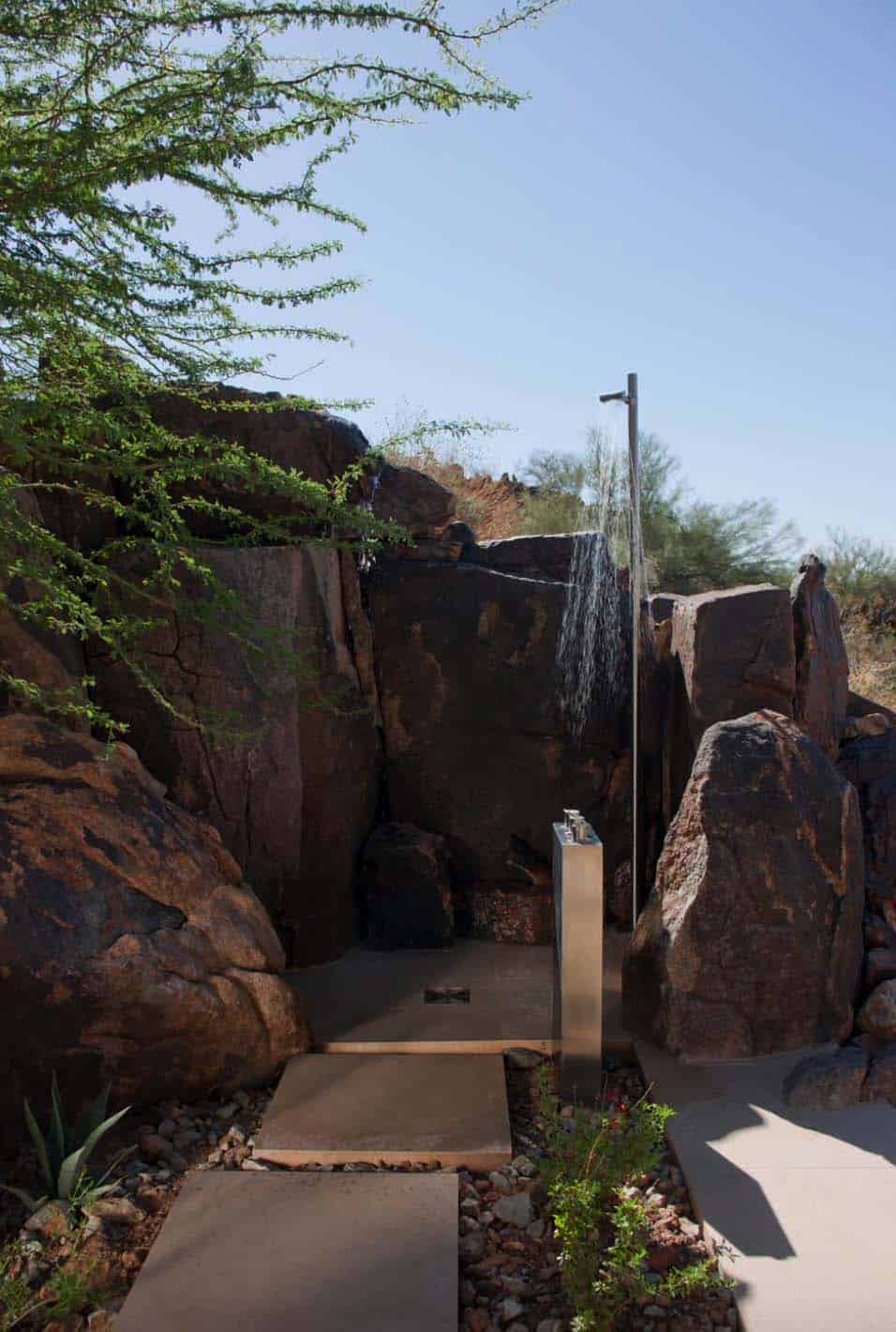 Modern desert home set on a rocky hillside with spectacular city views-26