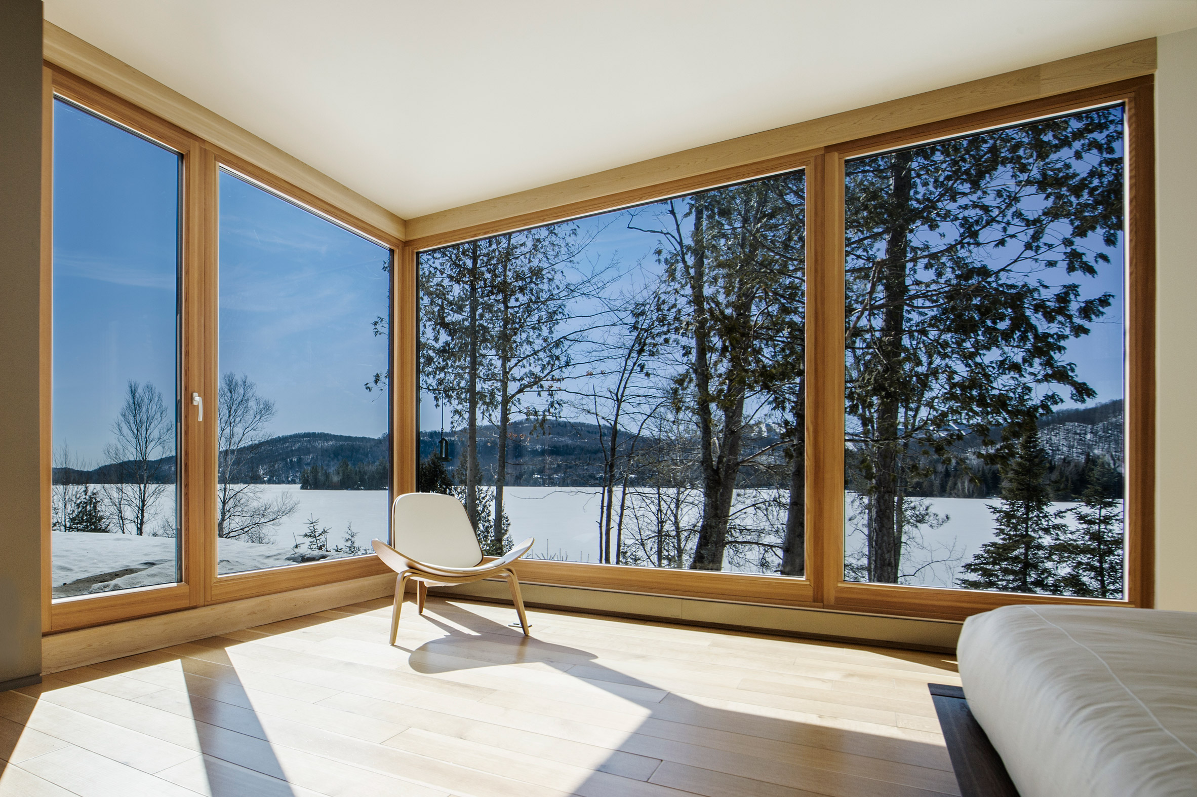 Quebec ski chalet by YH2 features V-shaped roof modelled on bird's wings-14