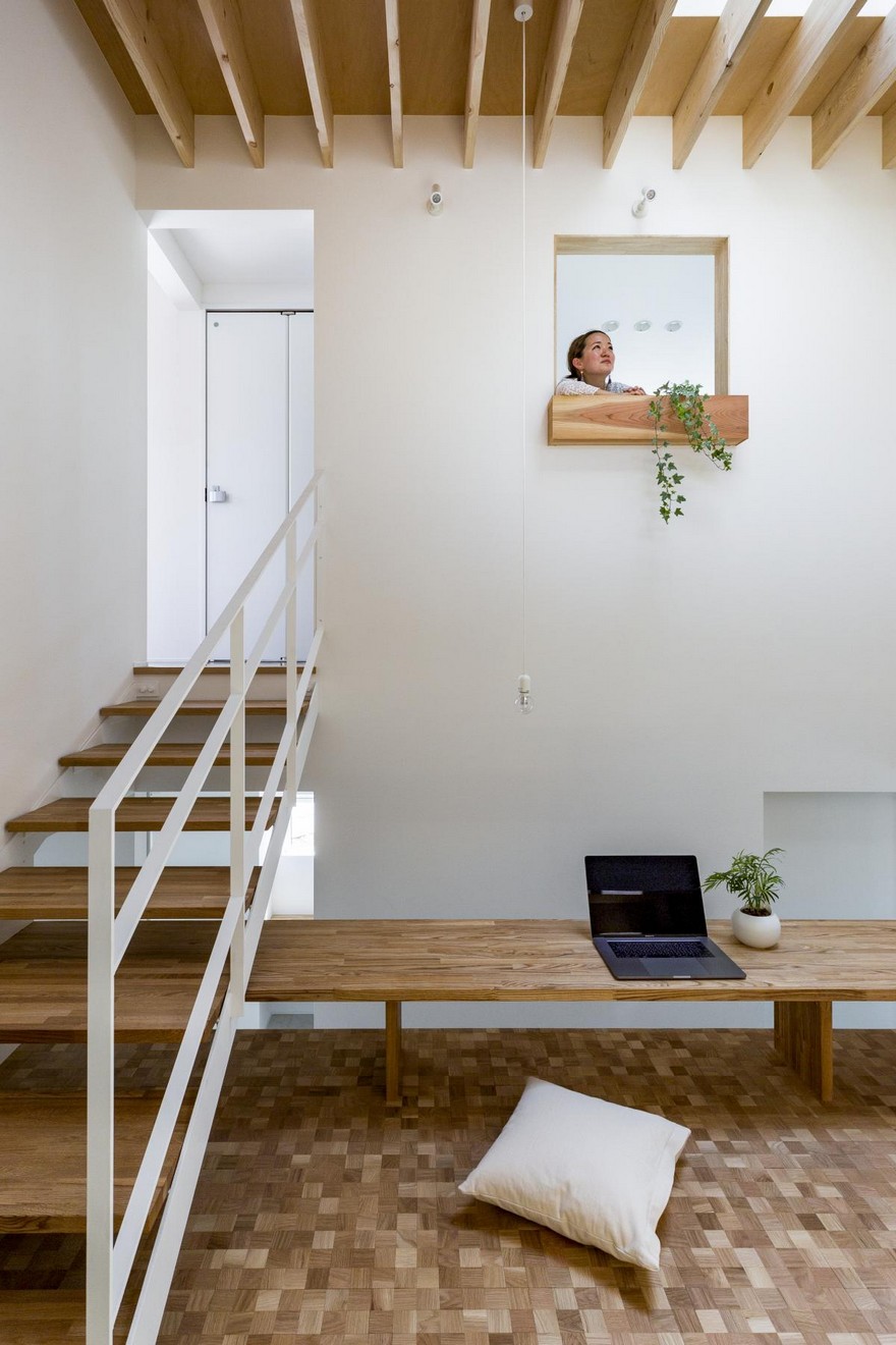 Box-Shaped Japanese Home with Warm Minimalist Interior Design-11