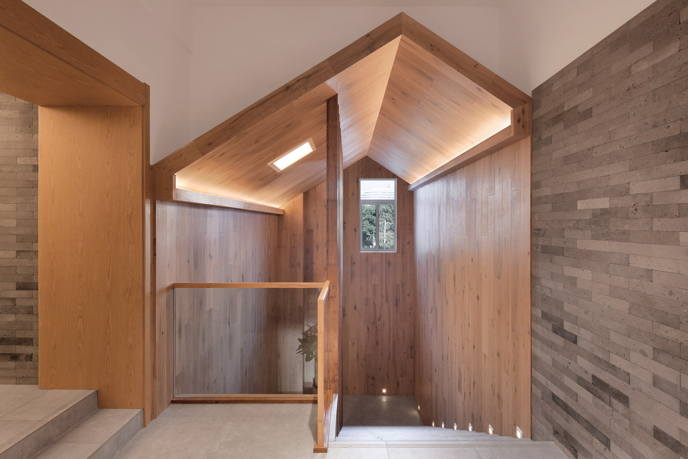 Penda inserts house-shaped opening into facade of hotel in Beijing hutong-22