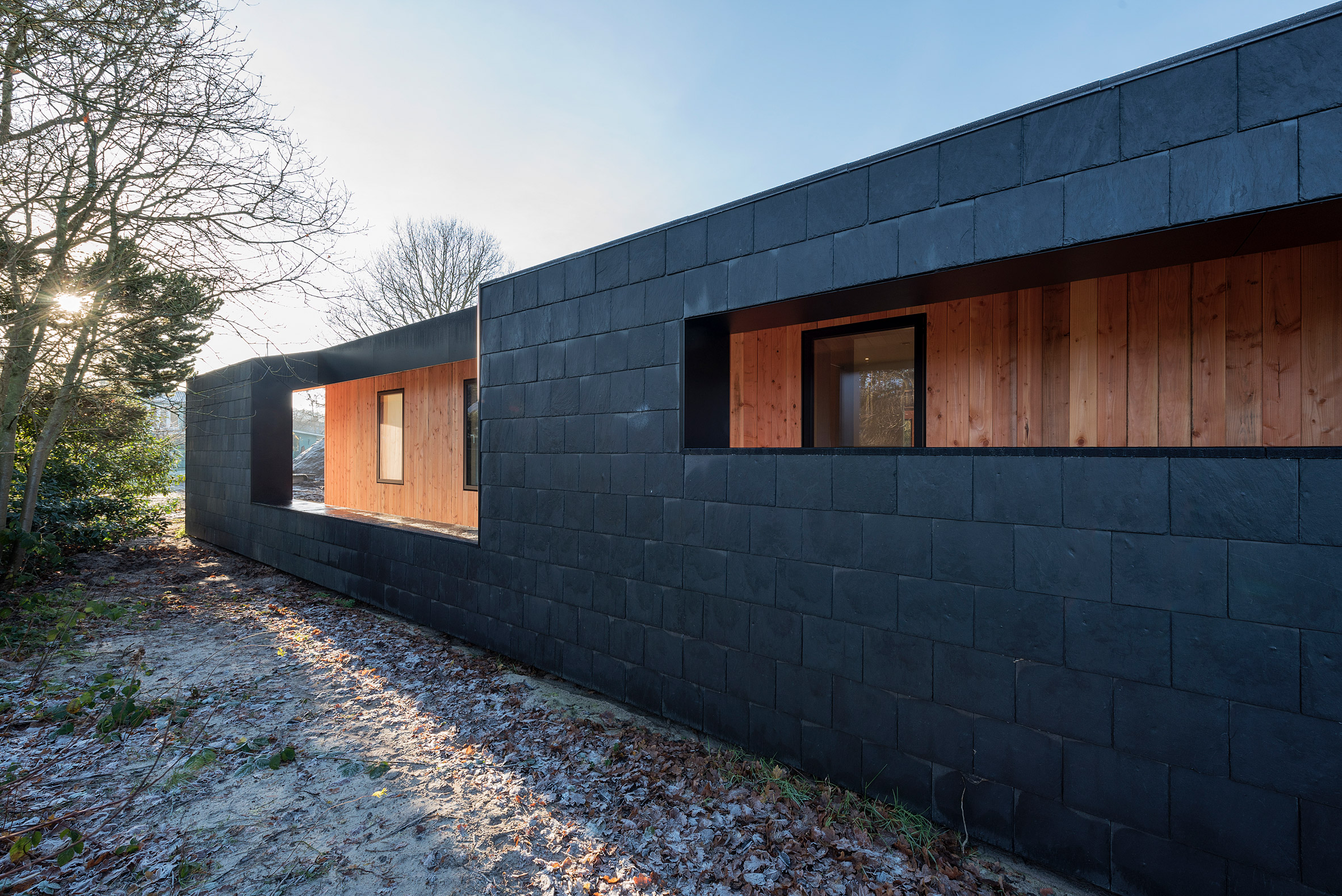 Oversized roof shelters terraces at CEBRA's Danish summer house-20