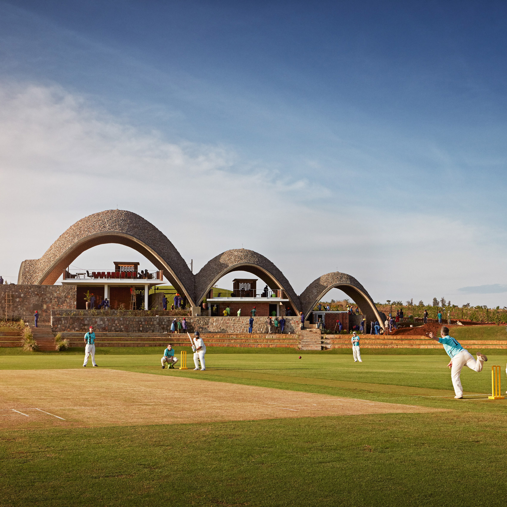 Light Earth Designs creates sustainable cricket pavilion featuring self-supporting parabolic roofs-0