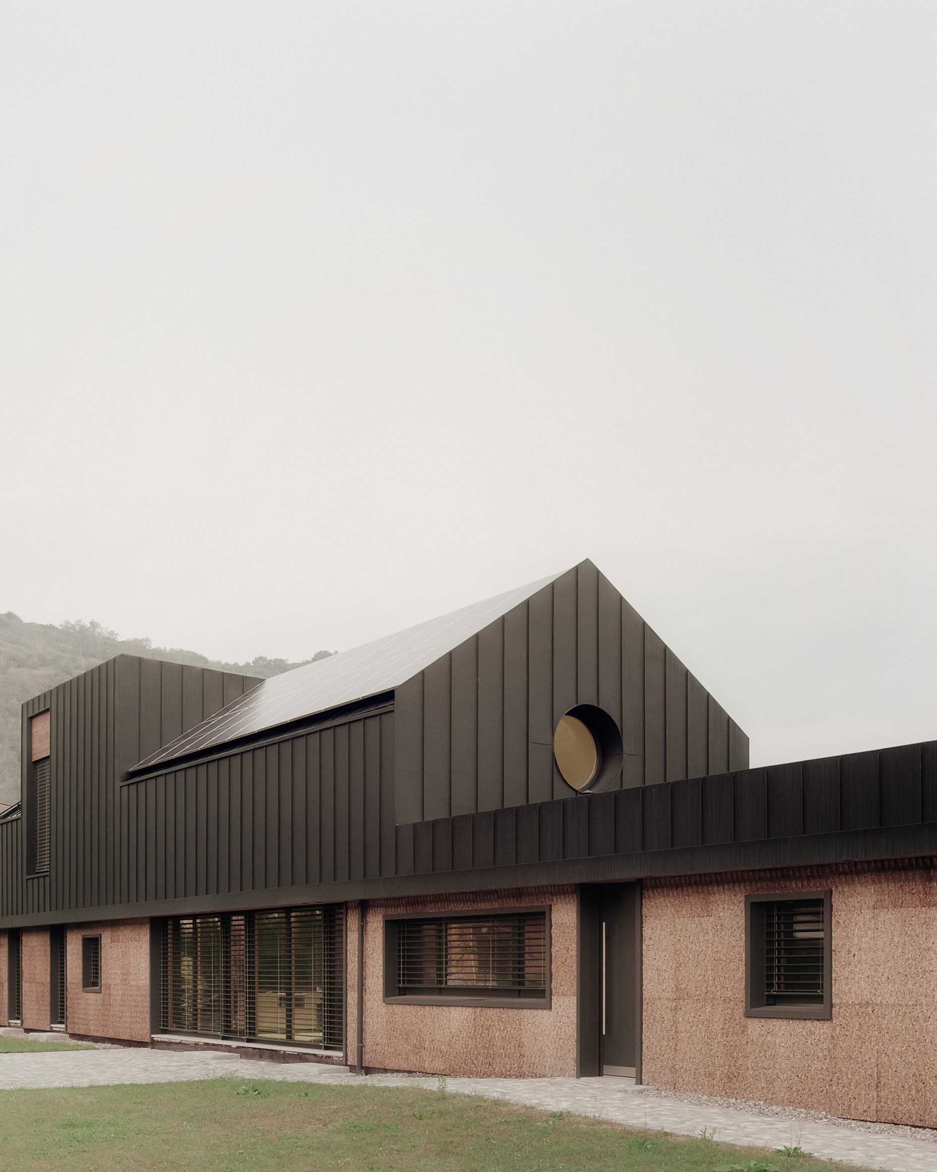 LCA Architetti nestles angular cork-clad home into Italian valley-4