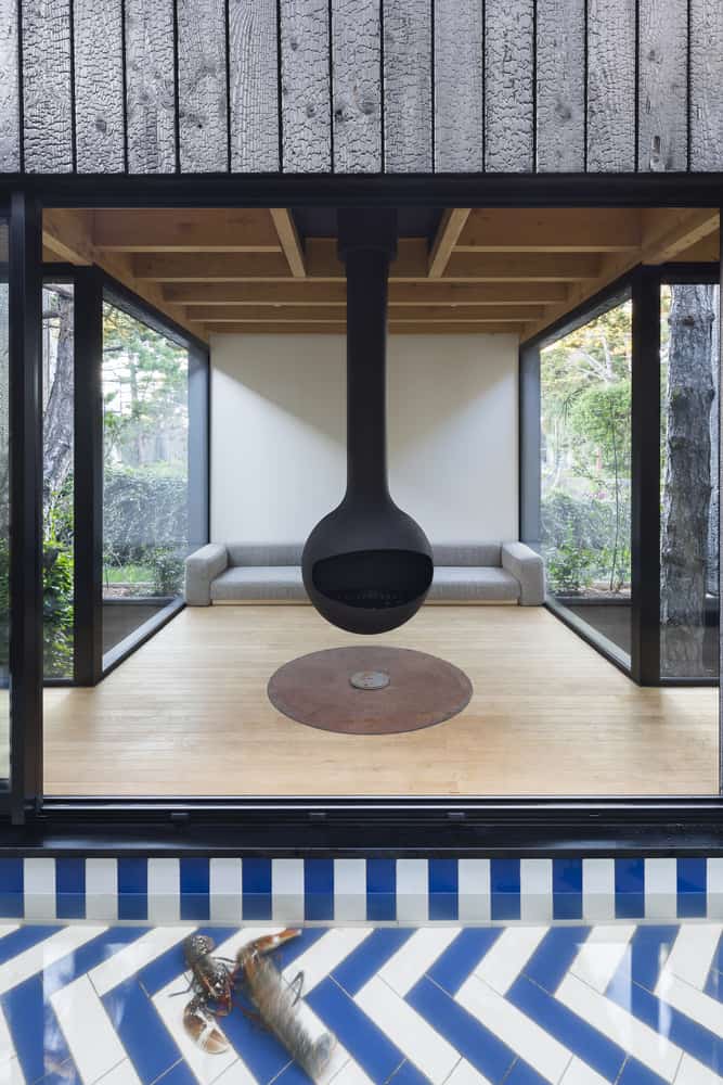 Uniquely Treehouse inspired house by Atelier Victoria Migliore features stilts, swings, and climbing nets just like the real thing-8