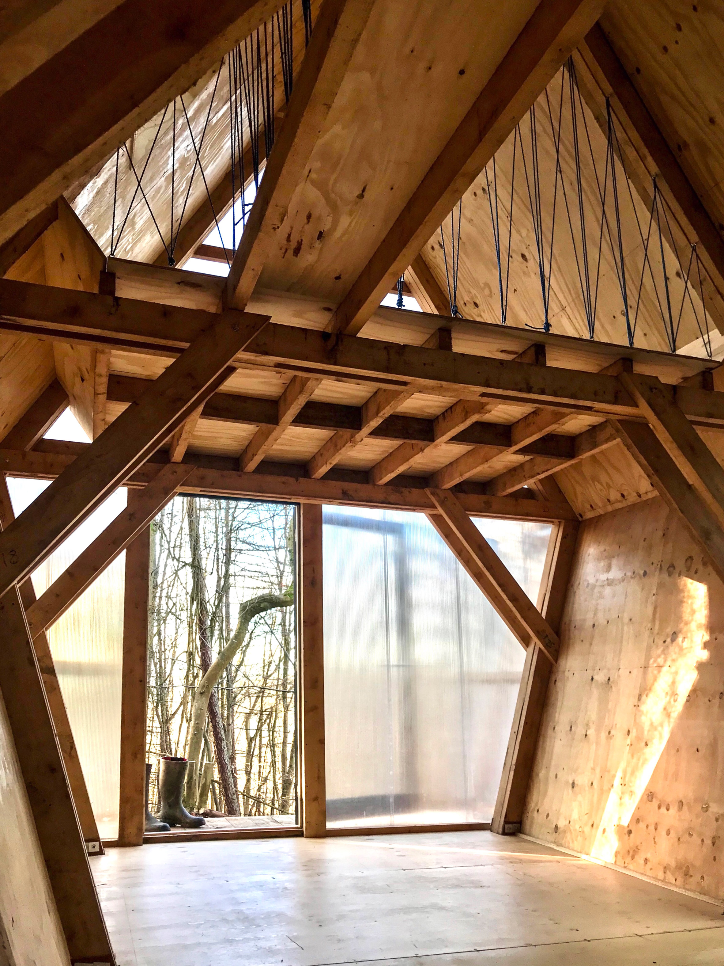 Low-cost micro home is made from timber and scavenged materials-6