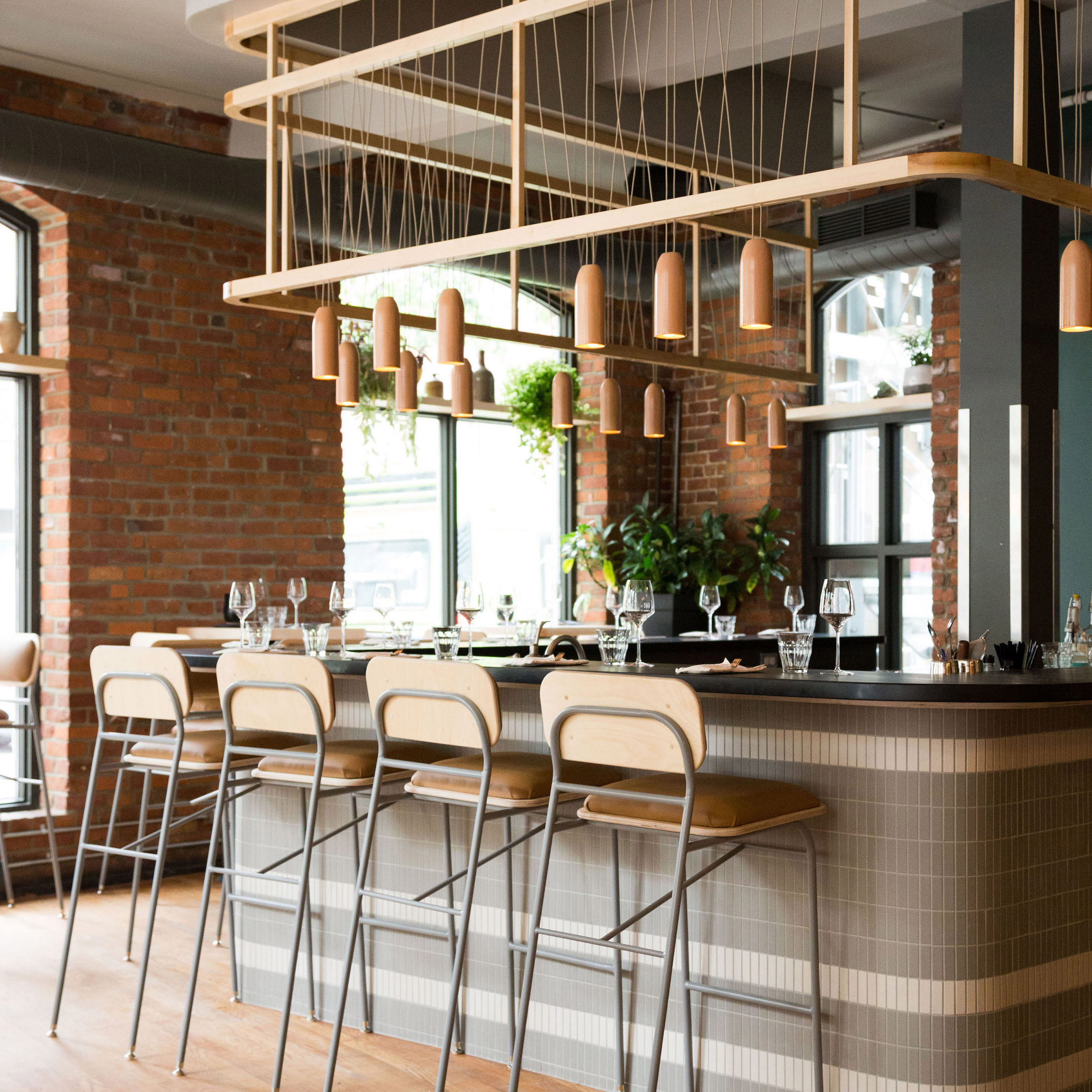 Atelier Filz designs bespoke lighting and chairs for restaurant in Quebec City-0