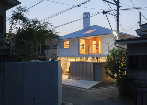 House in Kawanishi by Tato Architects with hipped roof and stilts-43