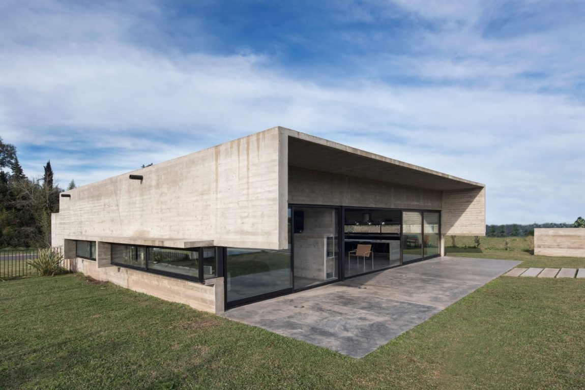 Spectacular Concrete House Surrounded by Fields and Vegetation-12