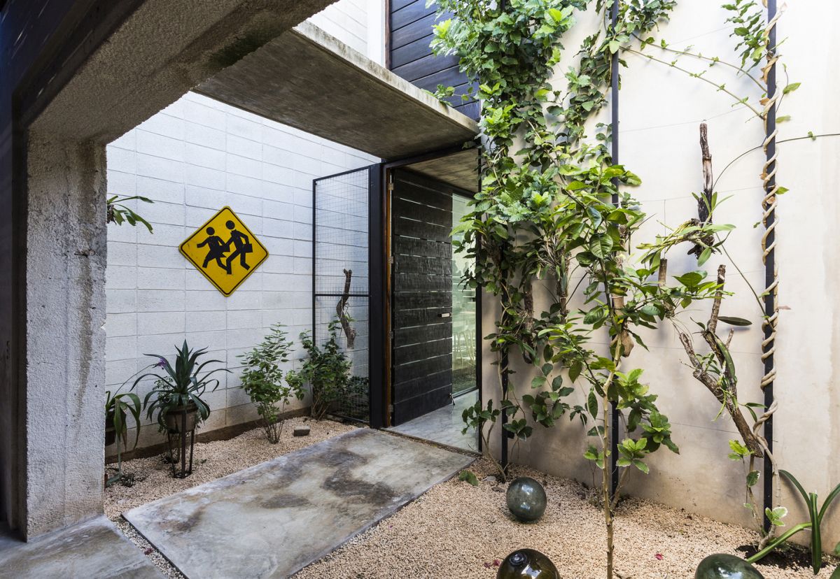 Narrow House Sandwiched Between Two Buildings And A Pool-3