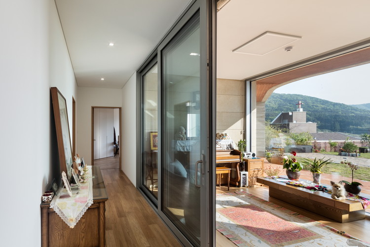 韩国海滨小屋,自然与建筑的和谐融合-23