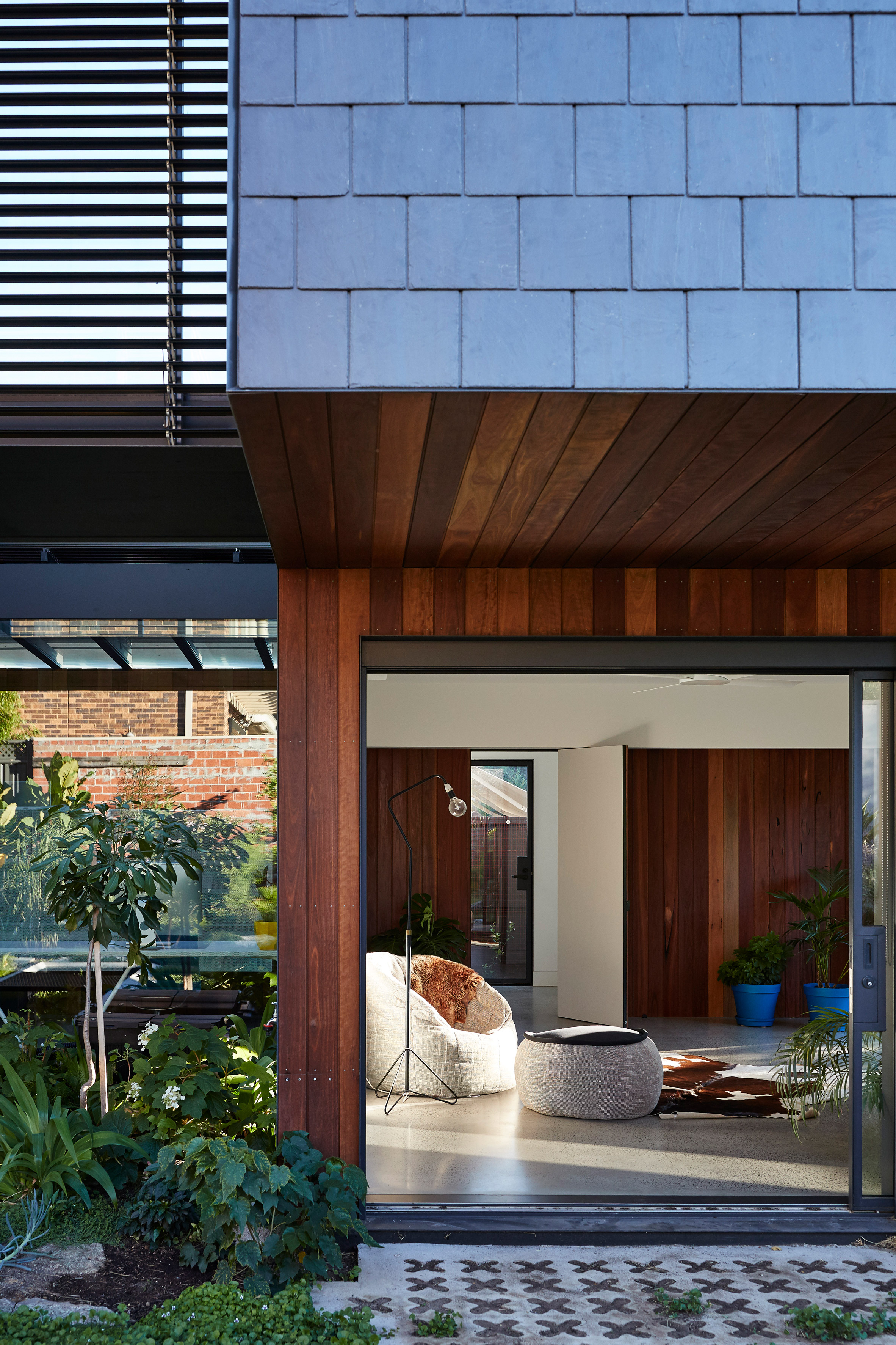 Diamond, scalloped and brick-shaped shingles cover Melbourne house by Austin Maynard Architects-10