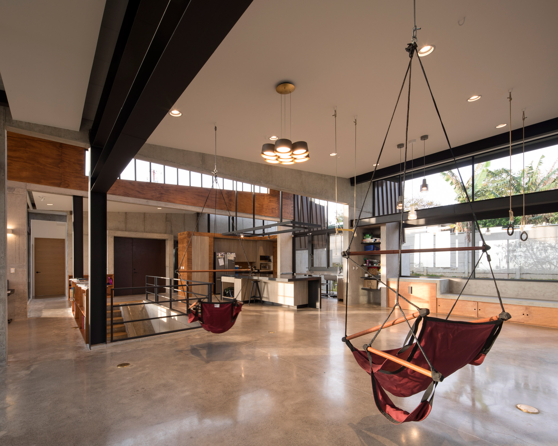 Grove of trees shades hillside Costa Rican house by Carazo Arquitectura-15