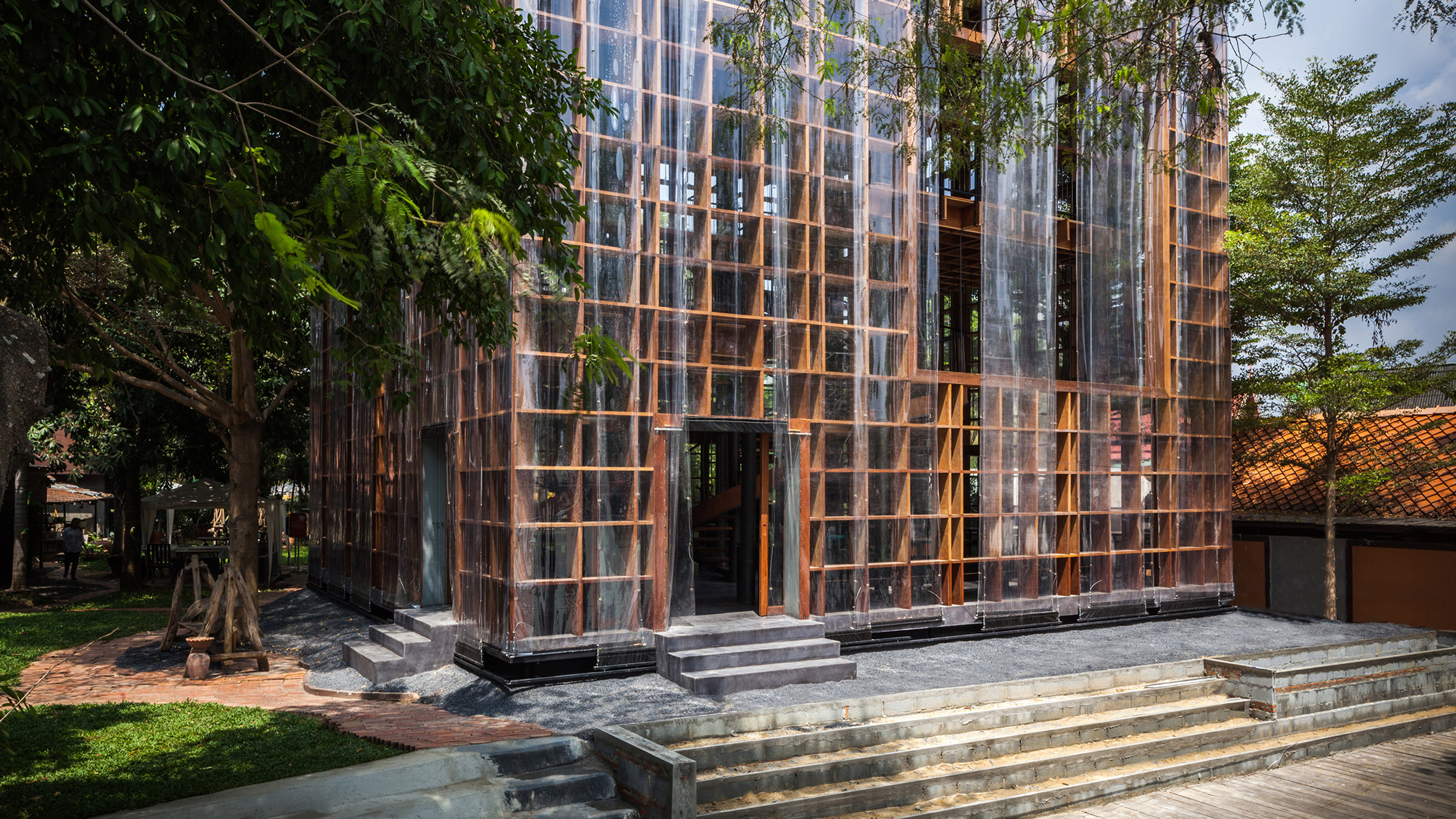 Bangkok Project Studio builds riverside wine bar with latticed plywood walls in Thailand-0
