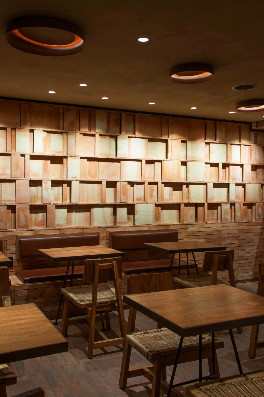 Faceted wooden panels form Mexico City cafe by Esrawe and Cadena-9