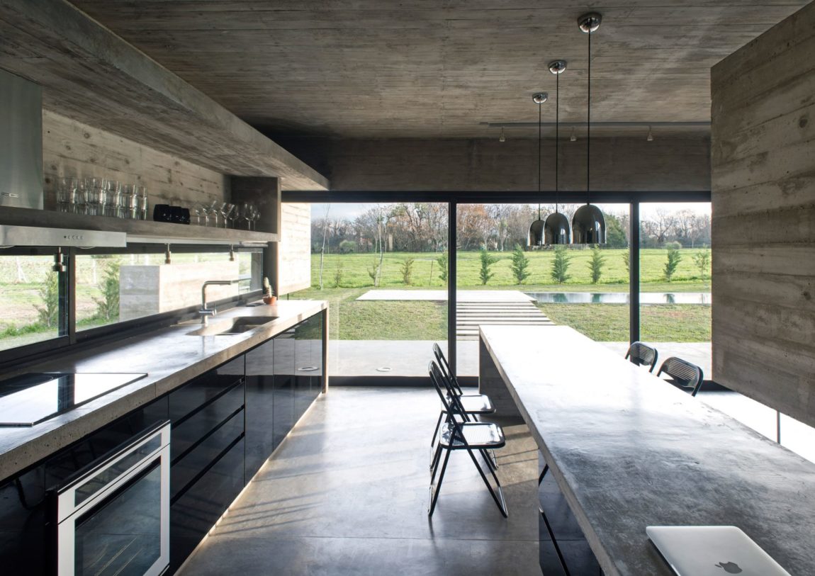 Spectacular Concrete House Surrounded by Fields and Vegetation-28