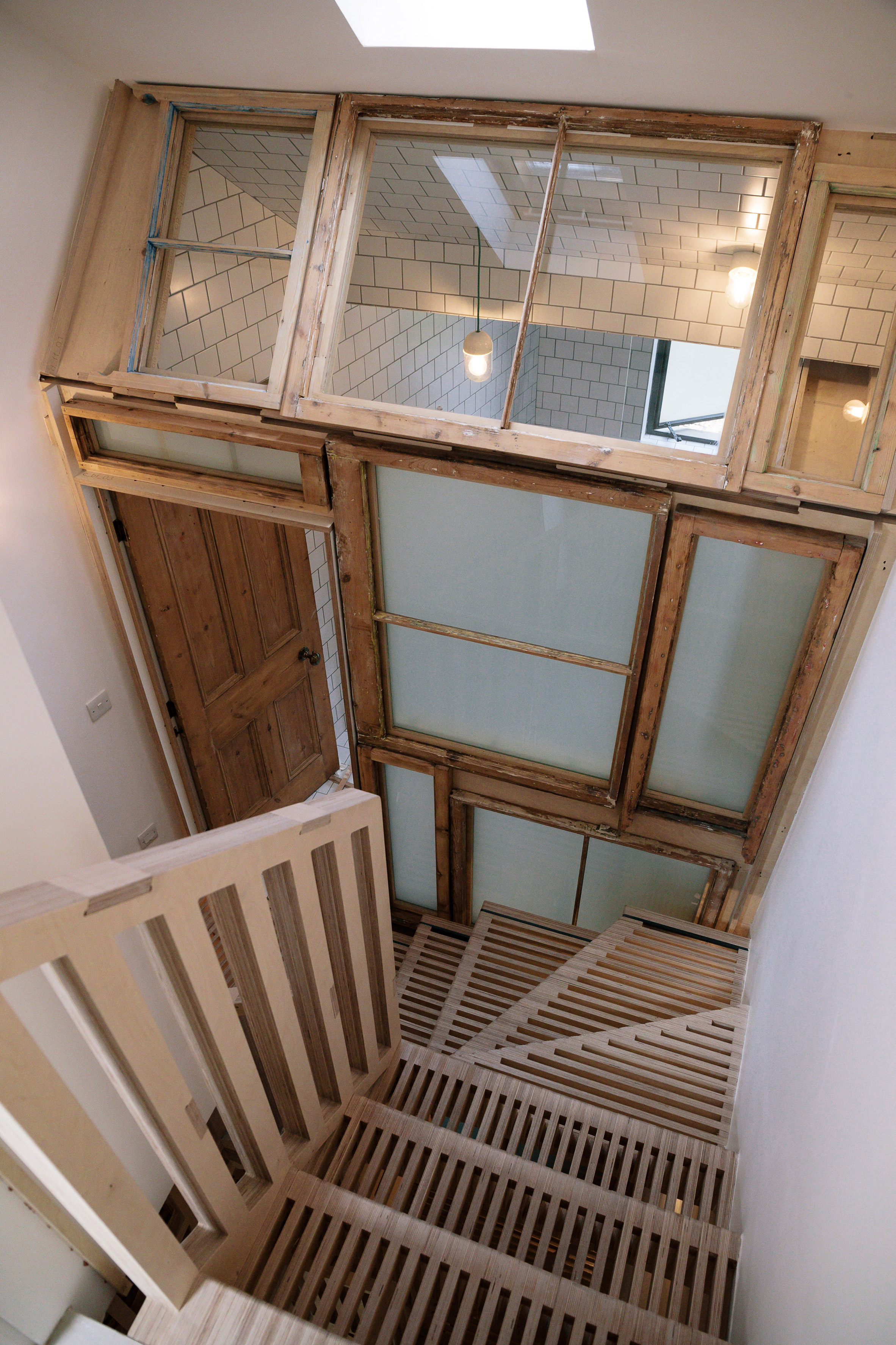 Tsuruta Architects designs staircase in London house from thousands of plywood pieces-7