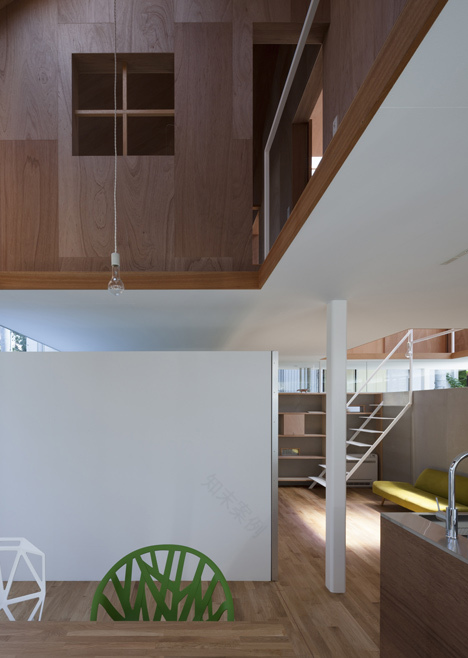 House in Kawanishi by Tato Architects with hipped roof and stilts-8