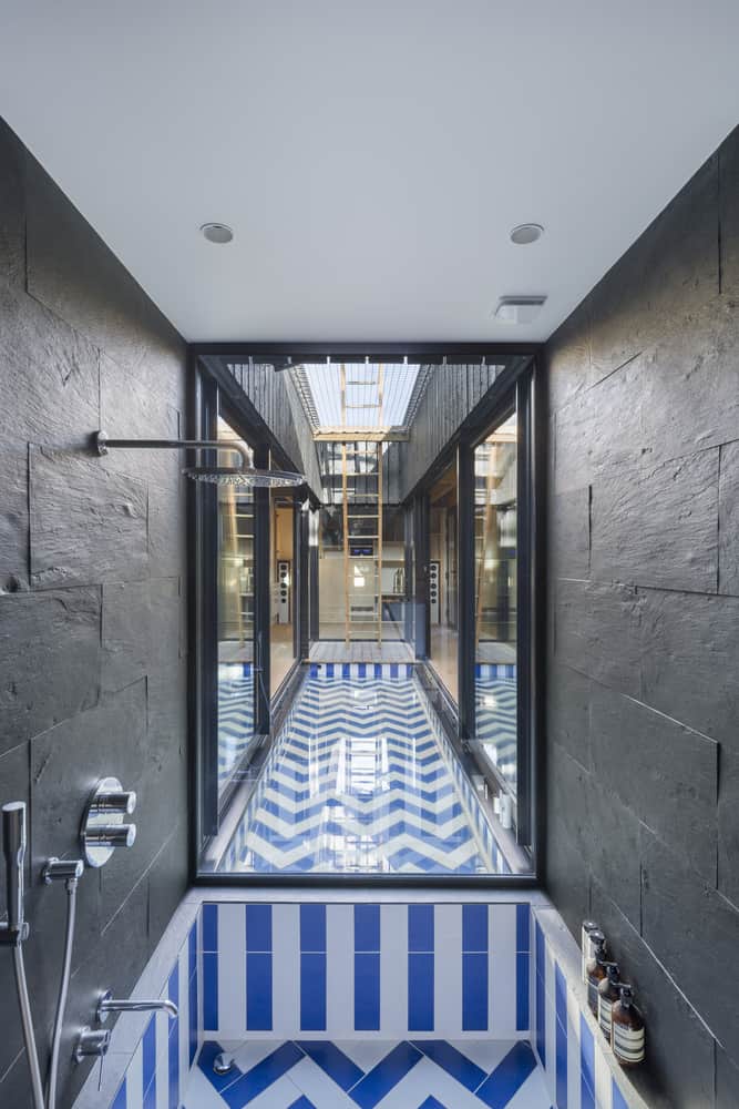 Uniquely Treehouse inspired house by Atelier Victoria Migliore features stilts, swings, and climbing nets just like the real thing-17