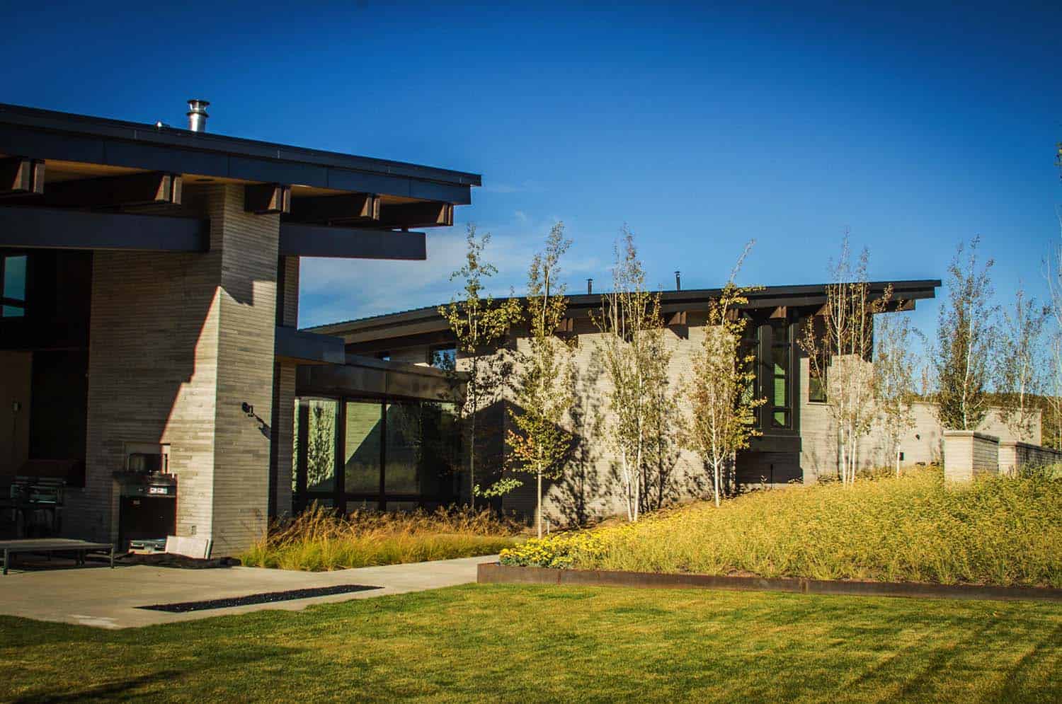 Majestic mountain home of stone and glass dominates its Utah landscape-4