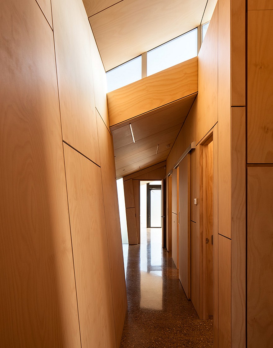 Rusted Steel Cladding House with Crafted Interior Finishes-15