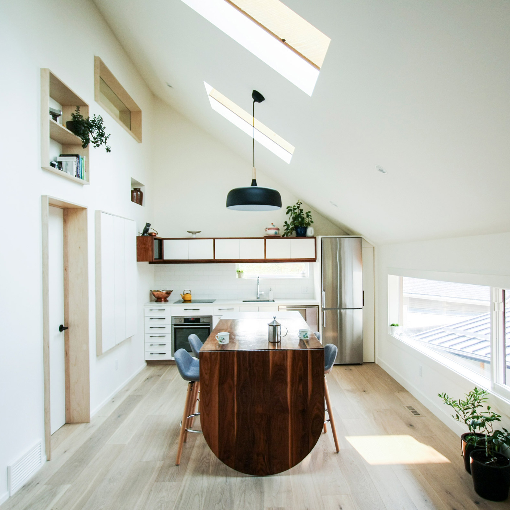 Dog nook and fireman's pole feature in laneway house by Studio North-0