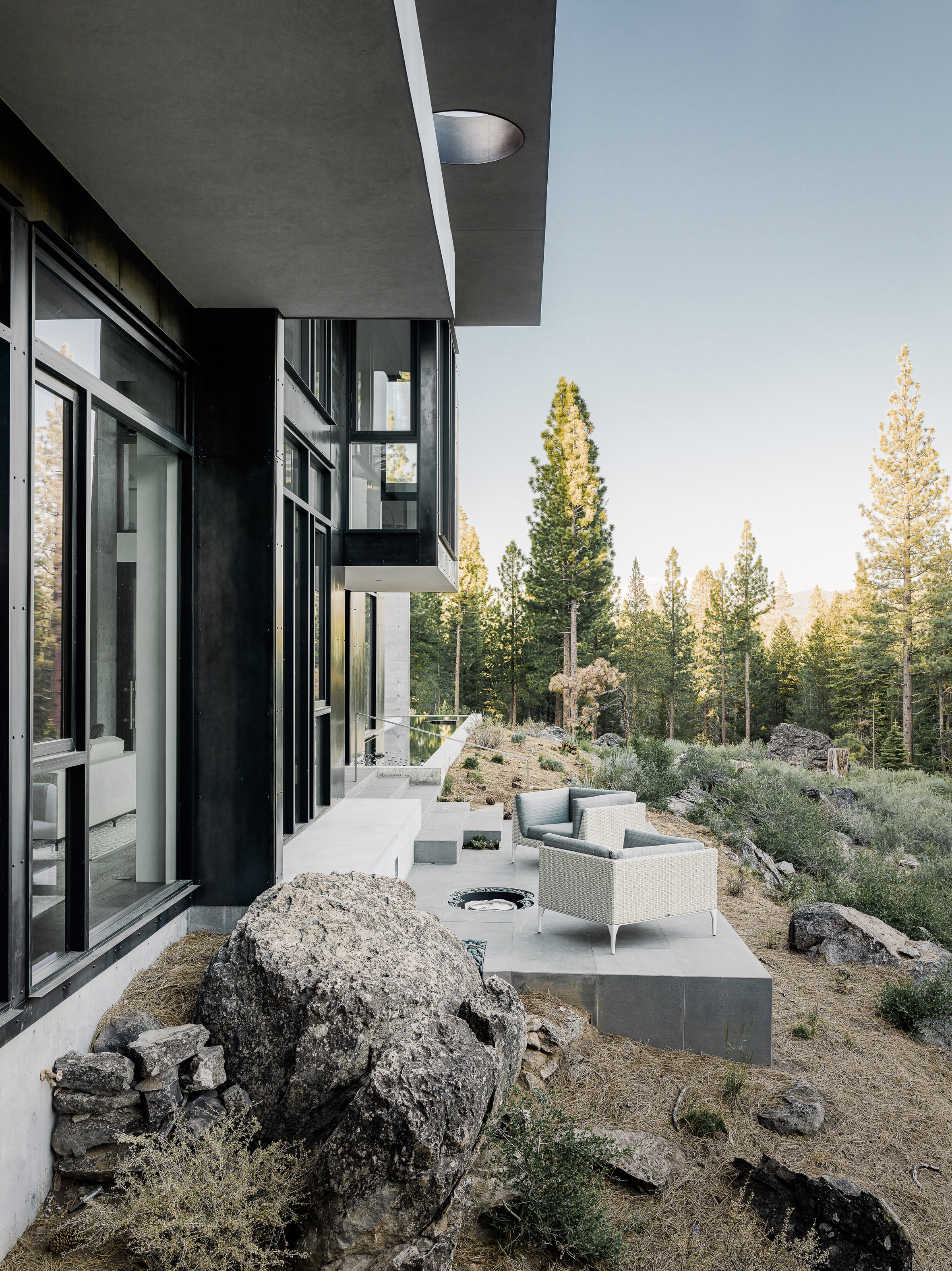 Creek House by Faulkner Architects preserves boulders on steep site-24