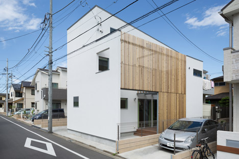 House K by Yuji Kimura Design conceals terraces behind a tall wall-2