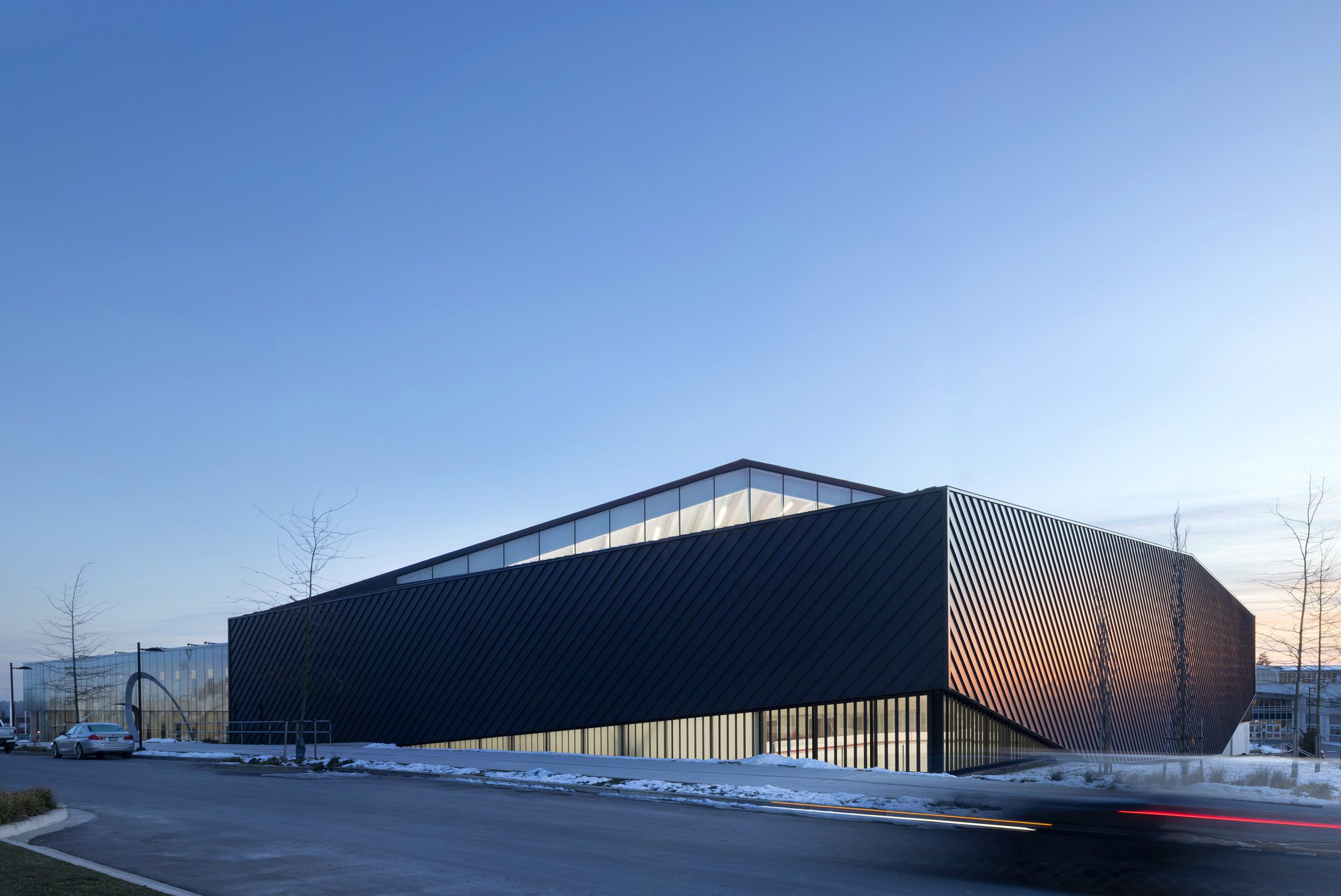 Mass timber adds visual warmth to British Columbia ice arena by HCMA-7