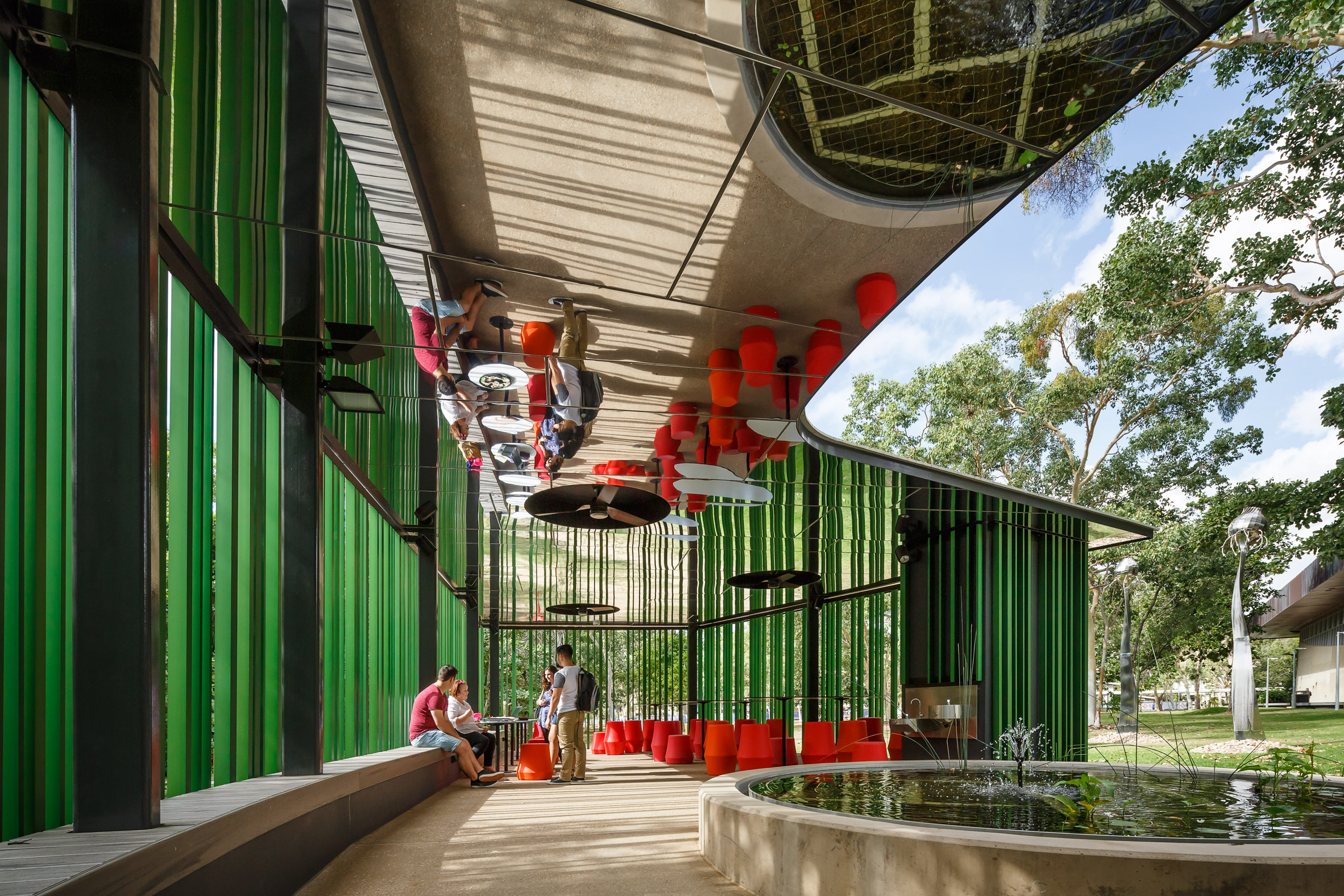 Mirrored ceilings reflect surroundings of walkway at Australian university-18