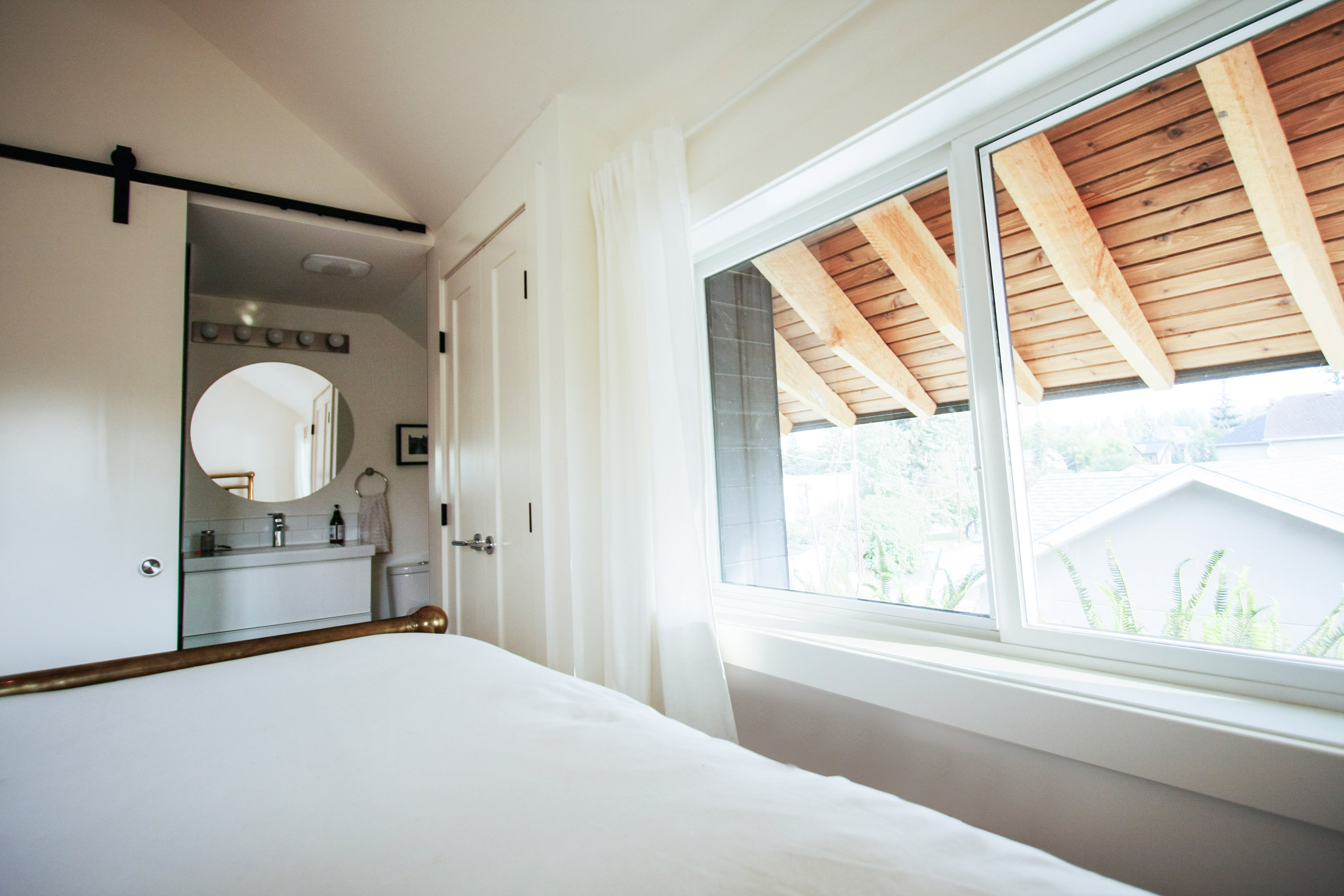 Dog nook and fireman's pole feature in laneway house by Studio North-14