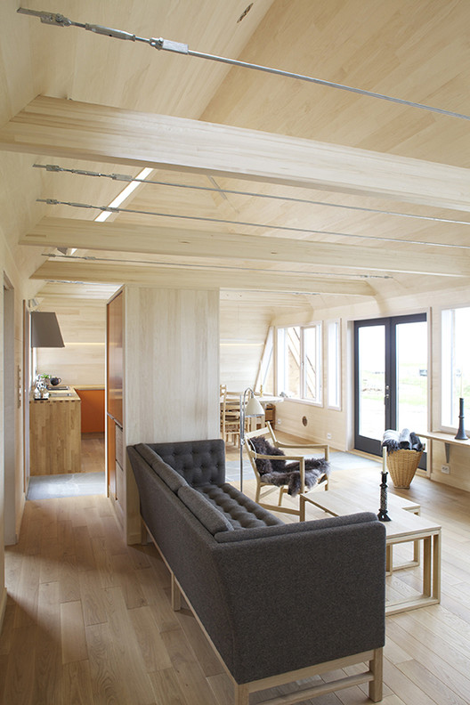 挪威海边现代共生小屋-13