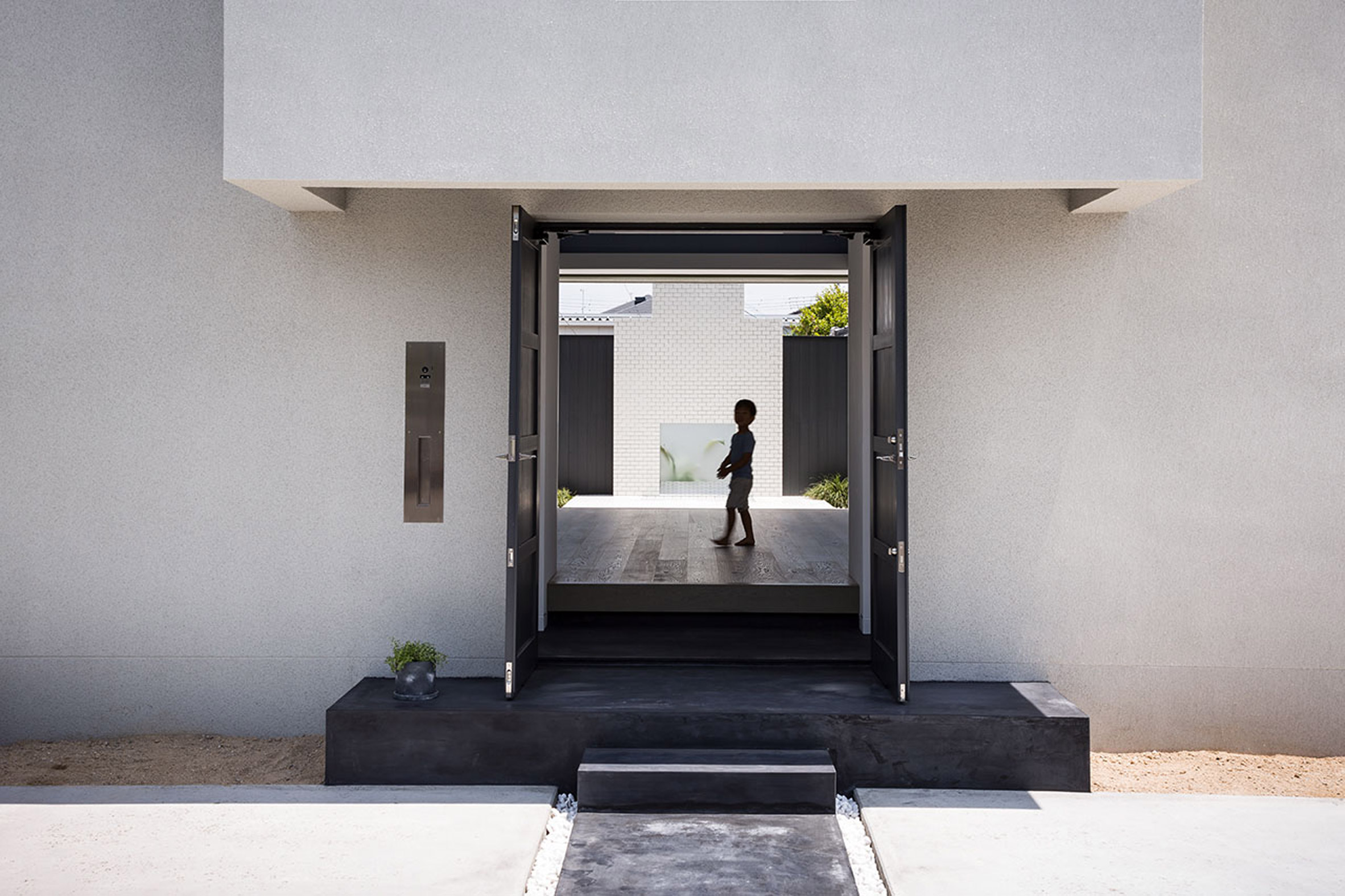 Kouichi Kimura designs Japanese house with white-tiled courtyard for yoga-4
