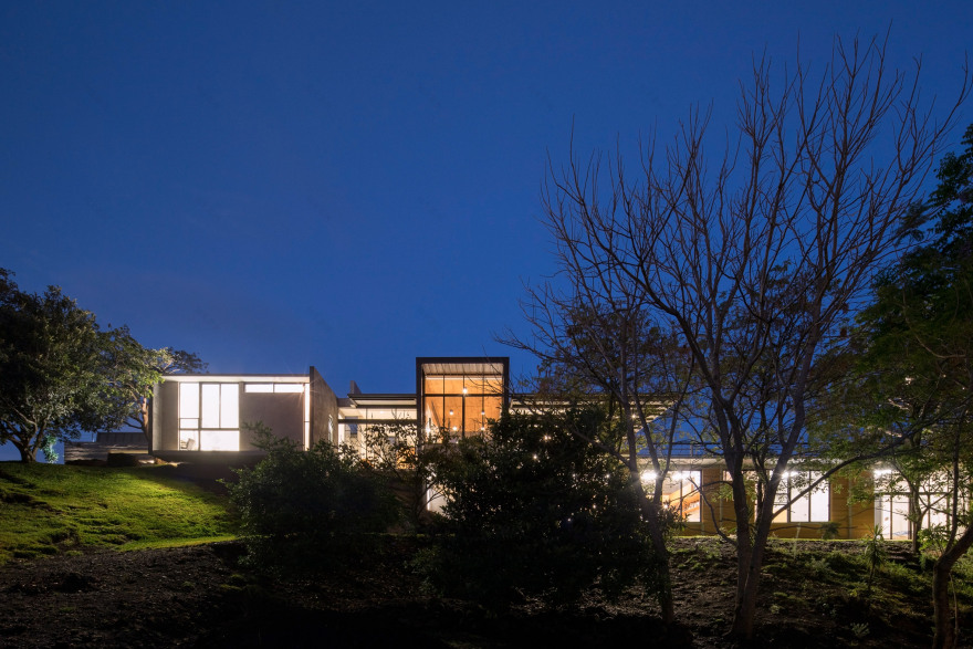 Grove of trees shades hillside Costa Rican house by Carazo Arquitectura-23