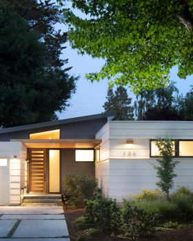 Hedge Extends to the Patio Through a Glass Wall