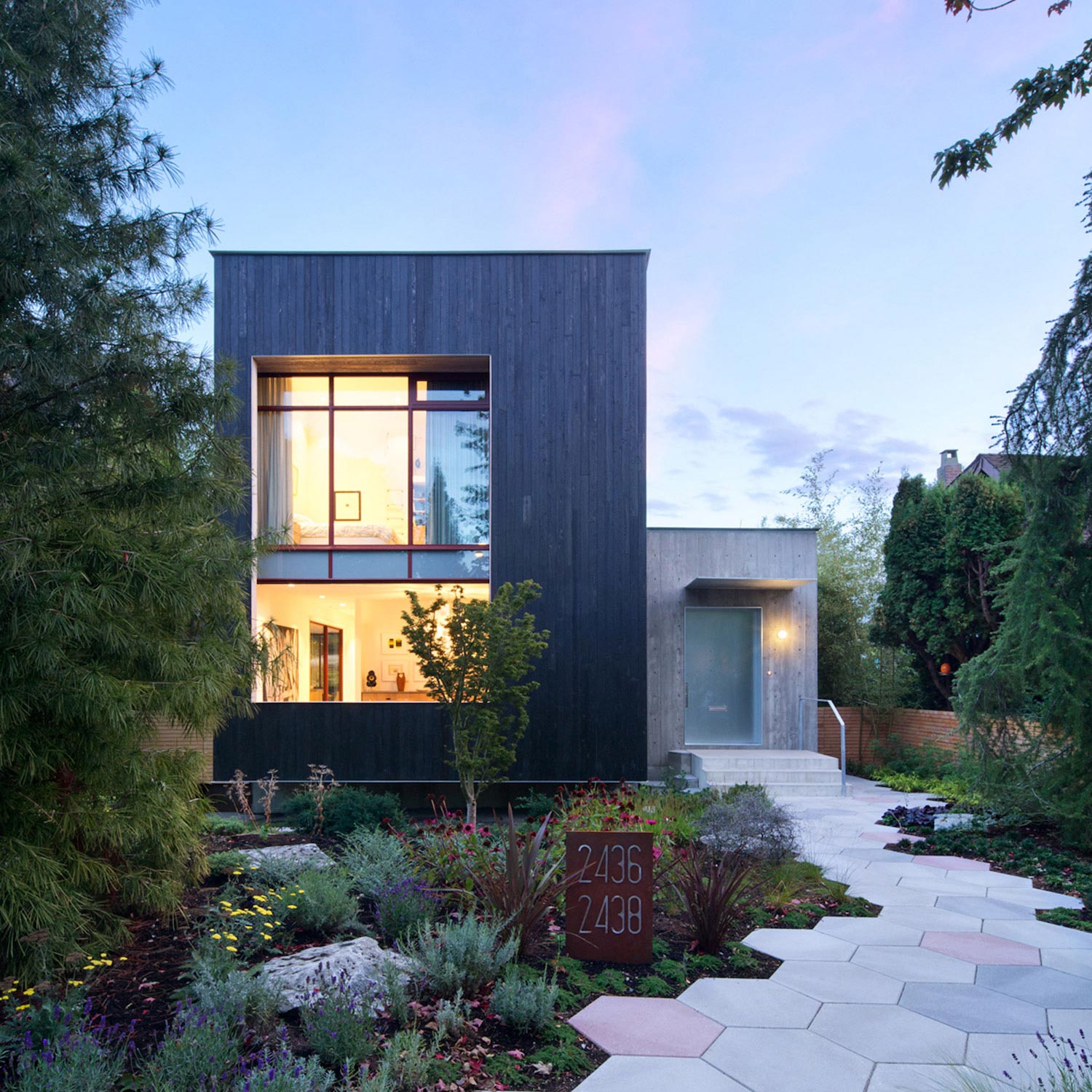 Measured Architecture has designed this modern house that opens up to a backyard patio area with a green wall   CAANdesign  Architecture and home design blog-13