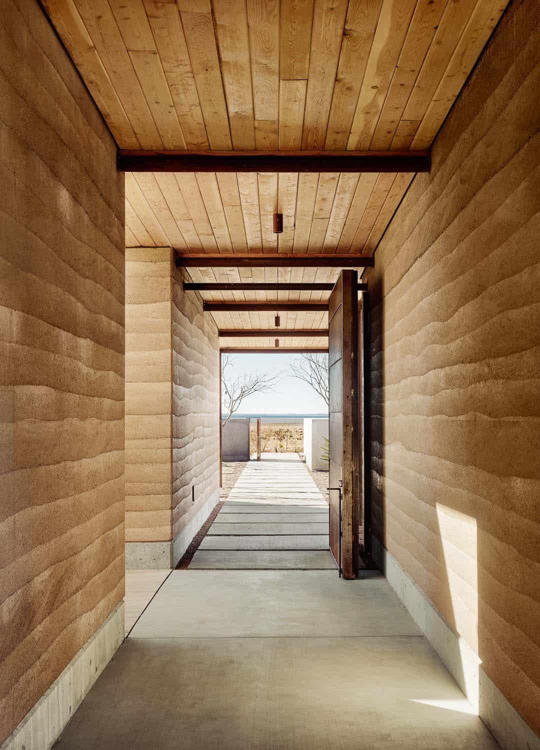 See this remarkable rammed earth house nestled on a Texas ranch-27
