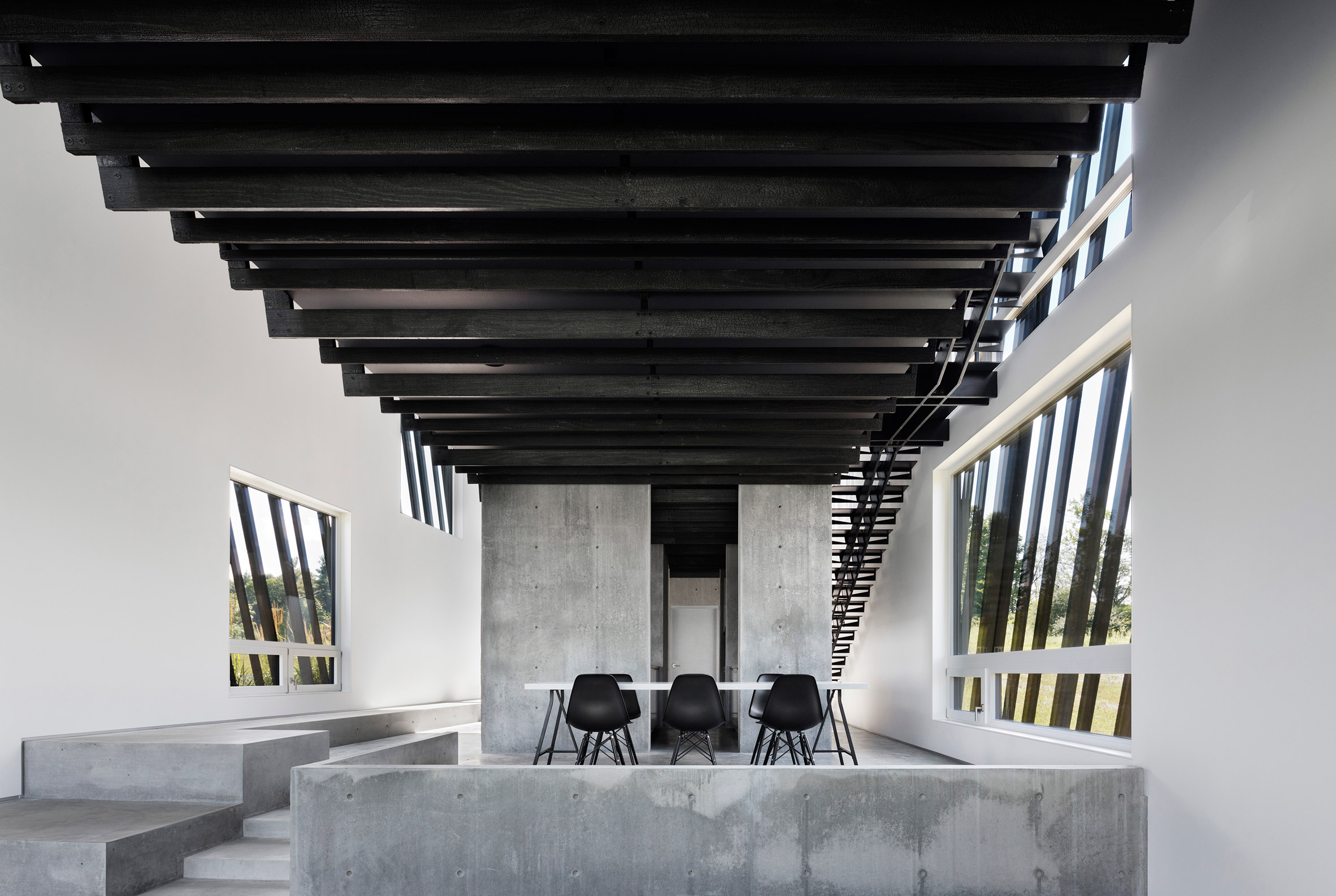 A/O builds slanted black holiday home in Hudson Valley-10