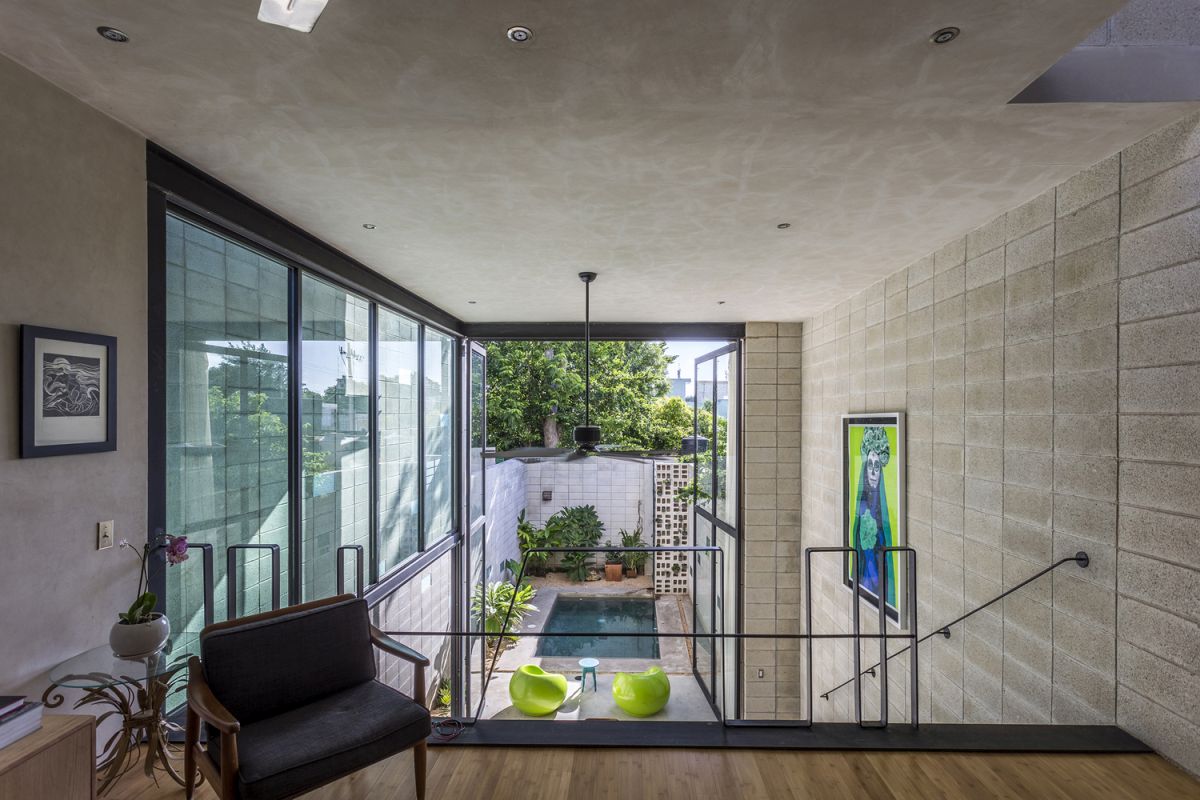 Narrow House Sandwiched Between Two Buildings And A Pool-6