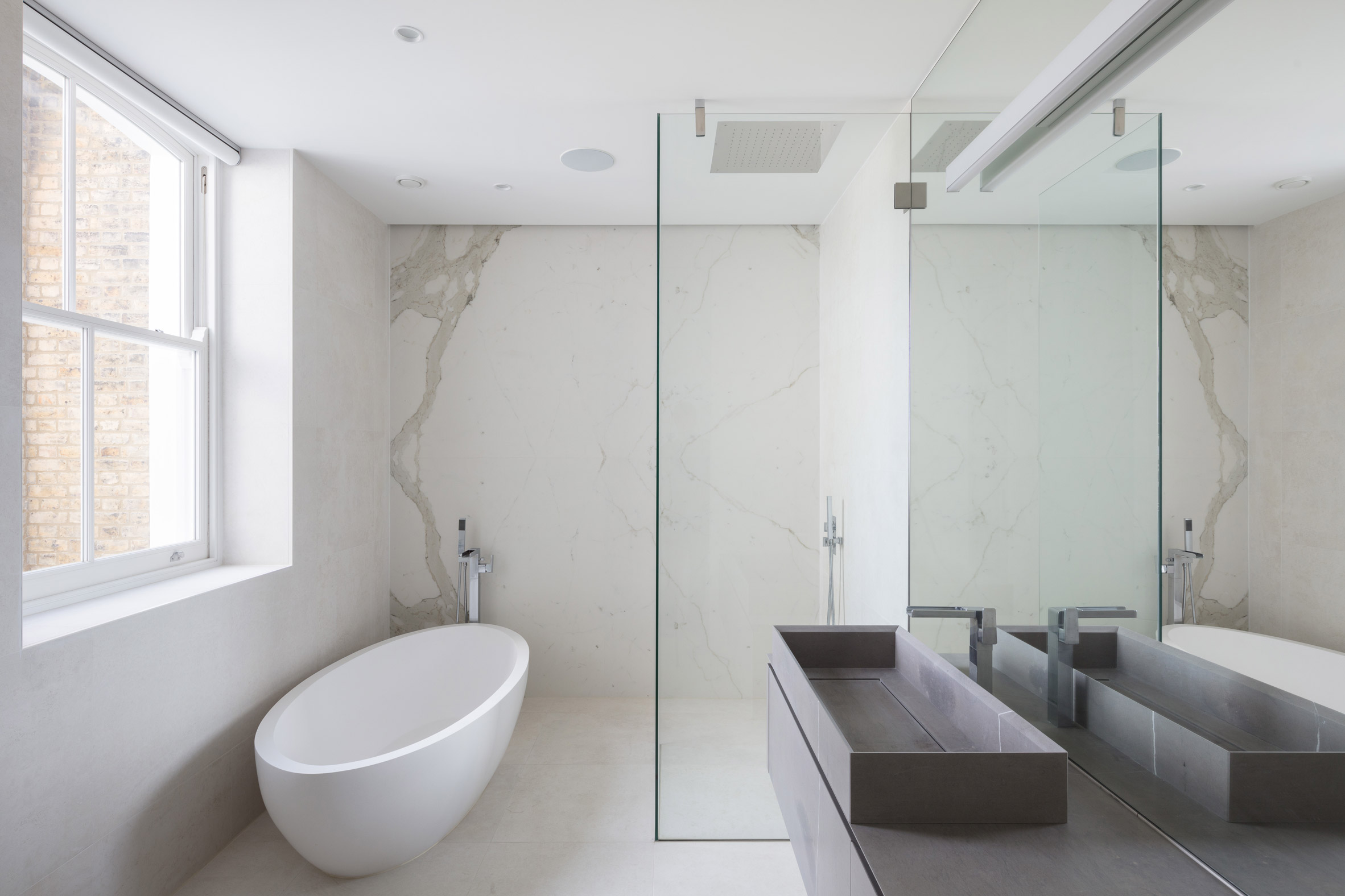 Glass box defines extension with basement pool to Victorian home in south London-17